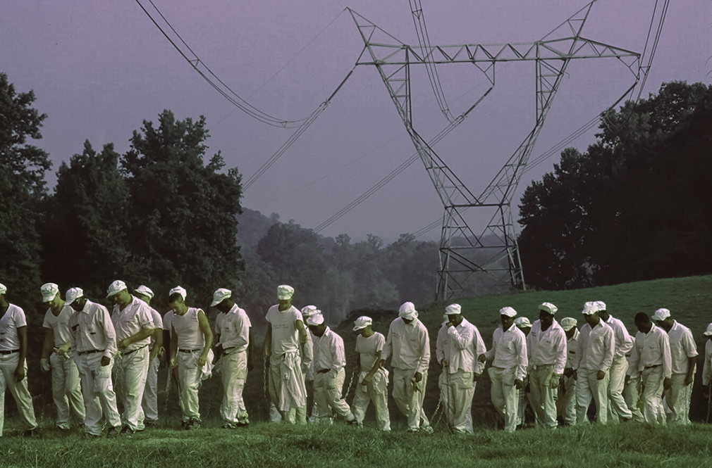 Harvest, Alabama. Feb 14, 1997. Inmates at the Limestone Correctional Center are marched out at dawn on a chain gang.