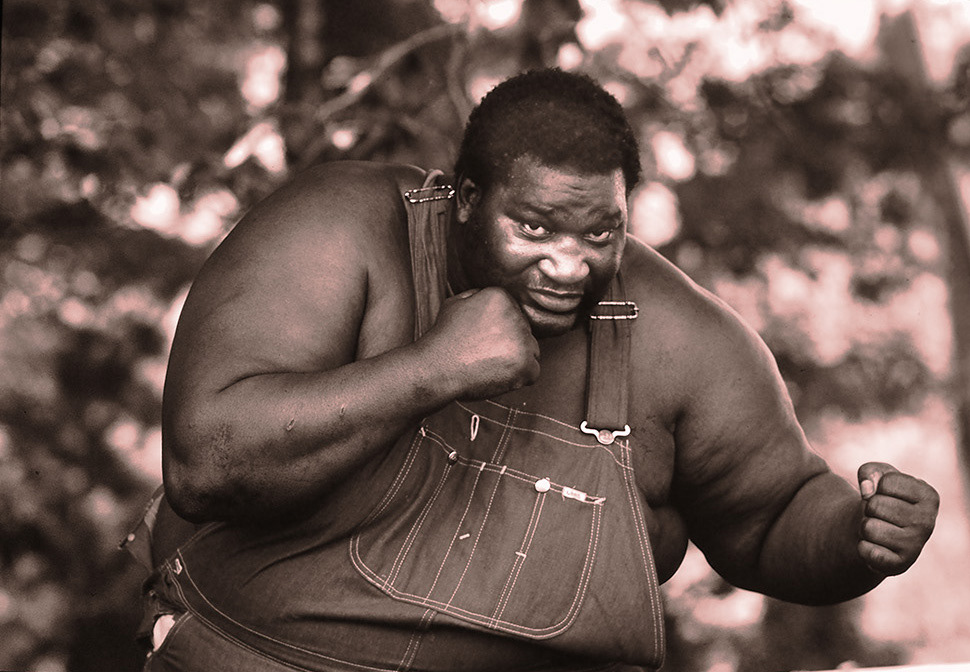 Buster Mathis Snr. Grand Rapids, Mi; 1979.. Buster Mathis fought Muhammad Ali losing by a unanimous decision at The Houstom Atrodome on Nov 17, 1971..He now works loading trucks.