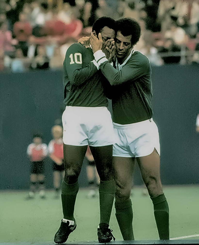 East Rutherford, Nj; Pele the great Brazilian football / soccer player becomes emotional as he bids farewell to 77,000 adoring fans before he plays his very last game for the NY Cosmos at Giants Stadium. His Brazilian colleague Carlos Alberto consoles him.