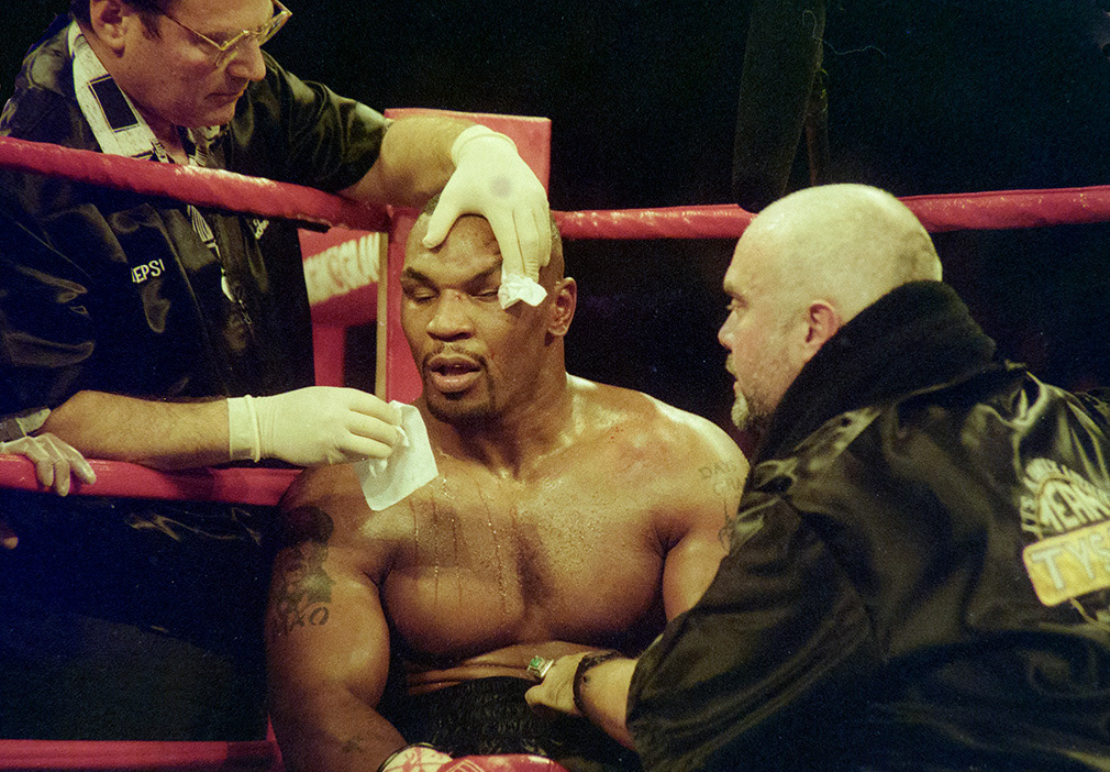 Lasa Vegas. Nv;November 9, 1996, Mike Tyson v Evander Holyfield at the MGM Grand Garden Arena in Paradise, Nevada. After being head-butted by his opponent in the fourth round Mike Tyson is treated by cut-man Dr.Ira Trocki as he is advised by corner man and good friend Jay Bright..