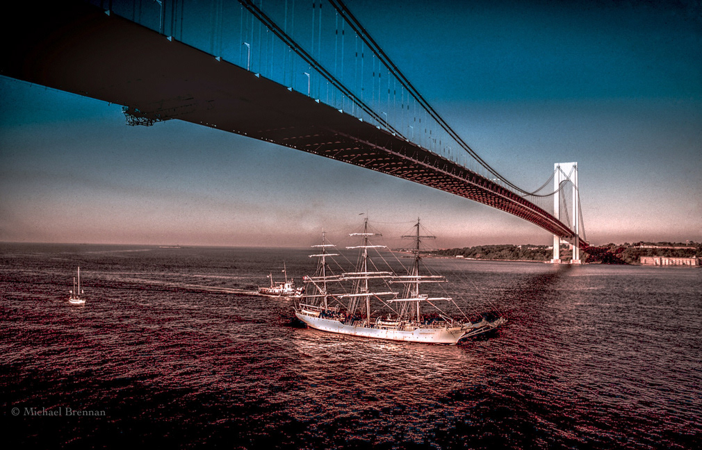 New York 1976. A "tall-ship" passes under The Verarzzano Bridge.