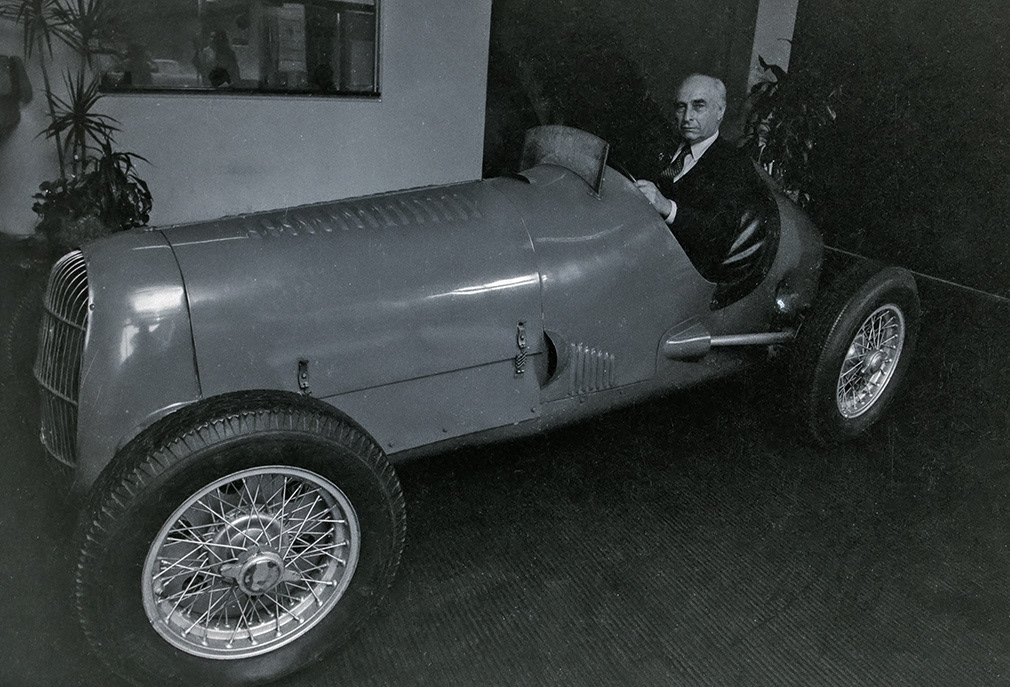 Buenos Aires, Argentina, May 1982. Juan Fangio known as El Maestro who dominated world motor racing in the early stages of it's history.A winner five times of World Champion driver. He is seen in Buenos Aires seated at the Mercedes-Benz showroom in one of his winning cars.