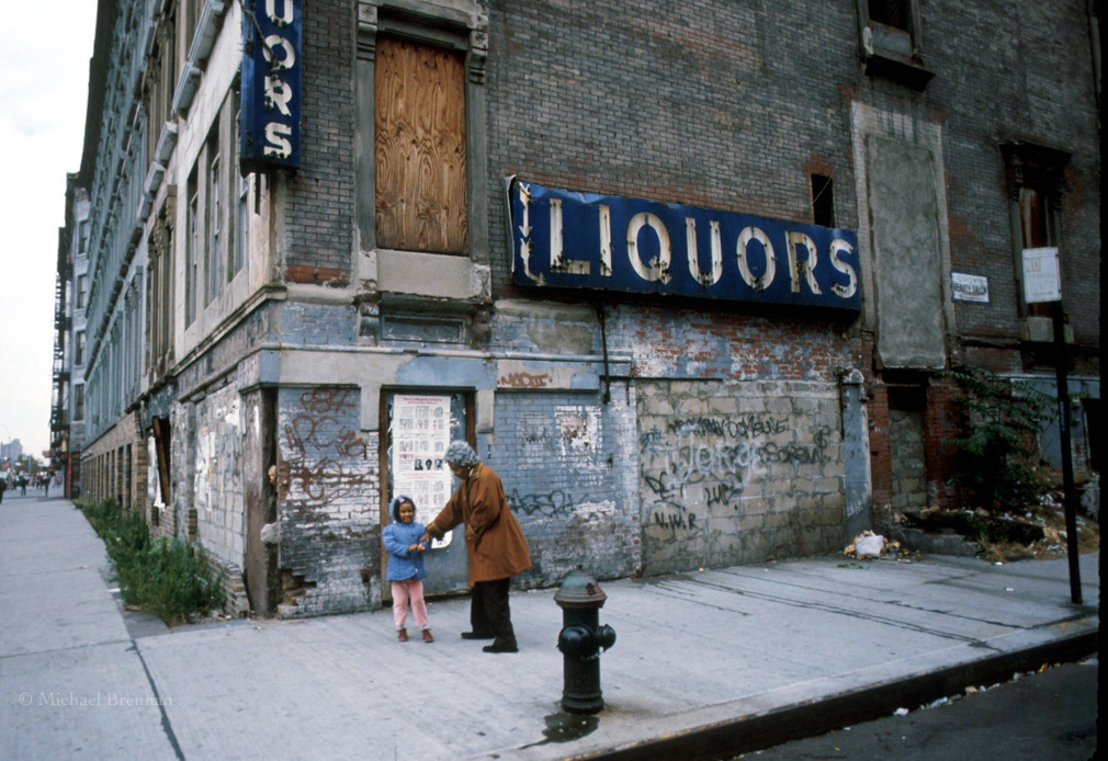 W122nd; Street, Harlem, NYC. March 1986. Clara Hale, aka “Mother Hale” walks with a small child who had been abandoned, on Harlems tough W122nd; Street. Mrs. Hale founded Hale House and was responsible for the rescue of hundreds of drug addicted babies.