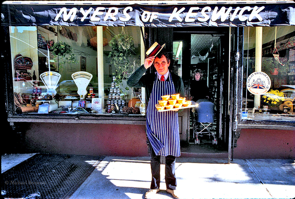 New York City. Peter Myers proprietor of Myers of Keswick stands outside his shop at 634 Hudson Street with his trademark delicacy...English Pork Pies.