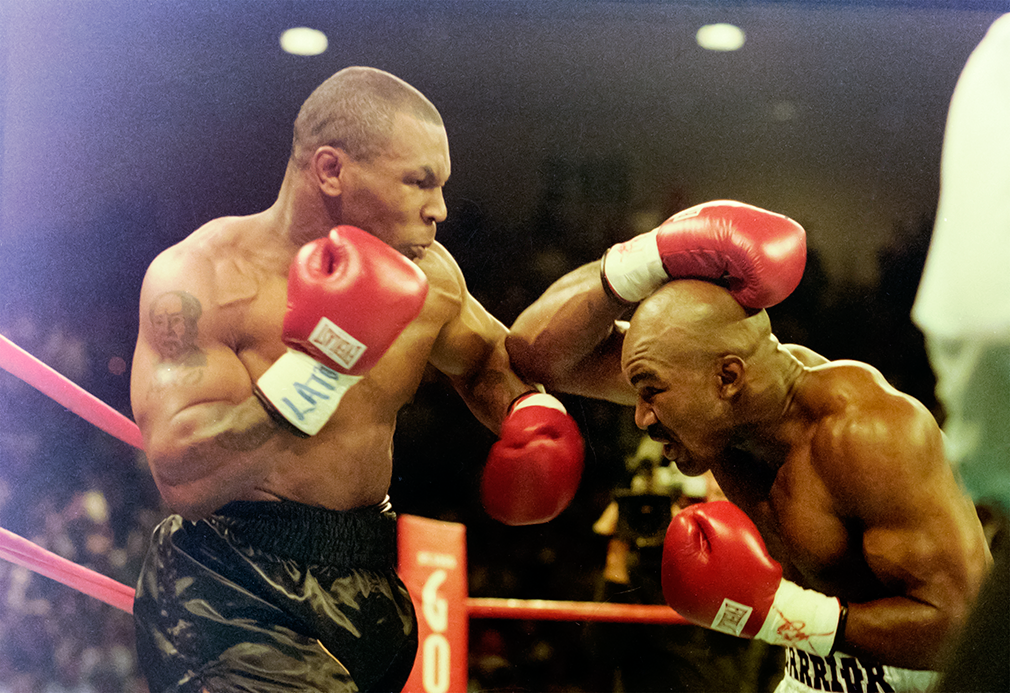 Las Vegas, Nv; June 28, 1997. Mike Tyson v Evander Holyfield 2, MGM Grand Arena. Holyfield uses his elbows as Tyson delivers a left hook. The fight descended into chaos and Mike Tyson was disqualified in the third round for biting Holyfield's right ear.