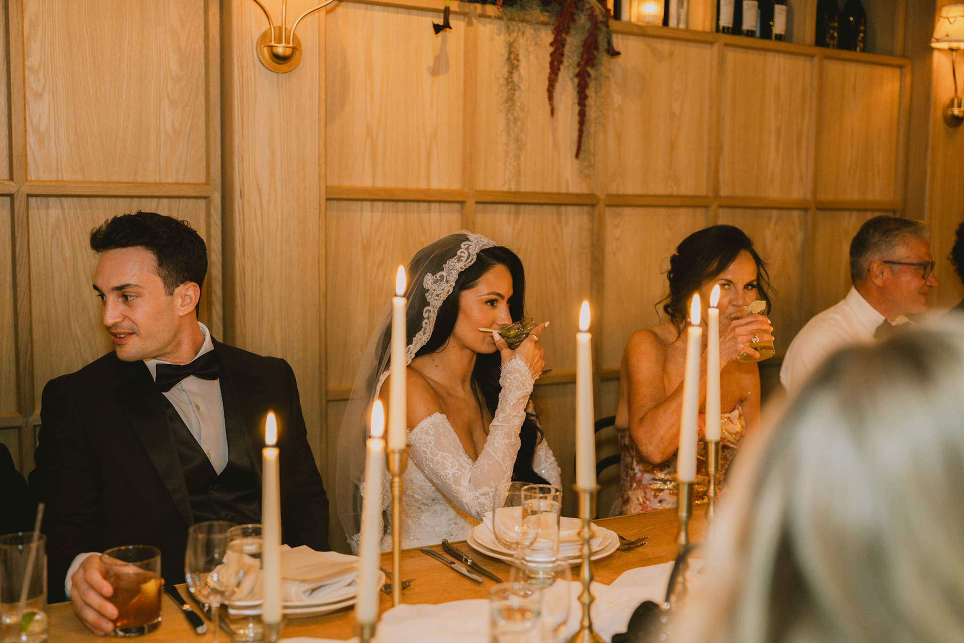 Bride and groom at their candlelit dinner in the Wythe Hotel.