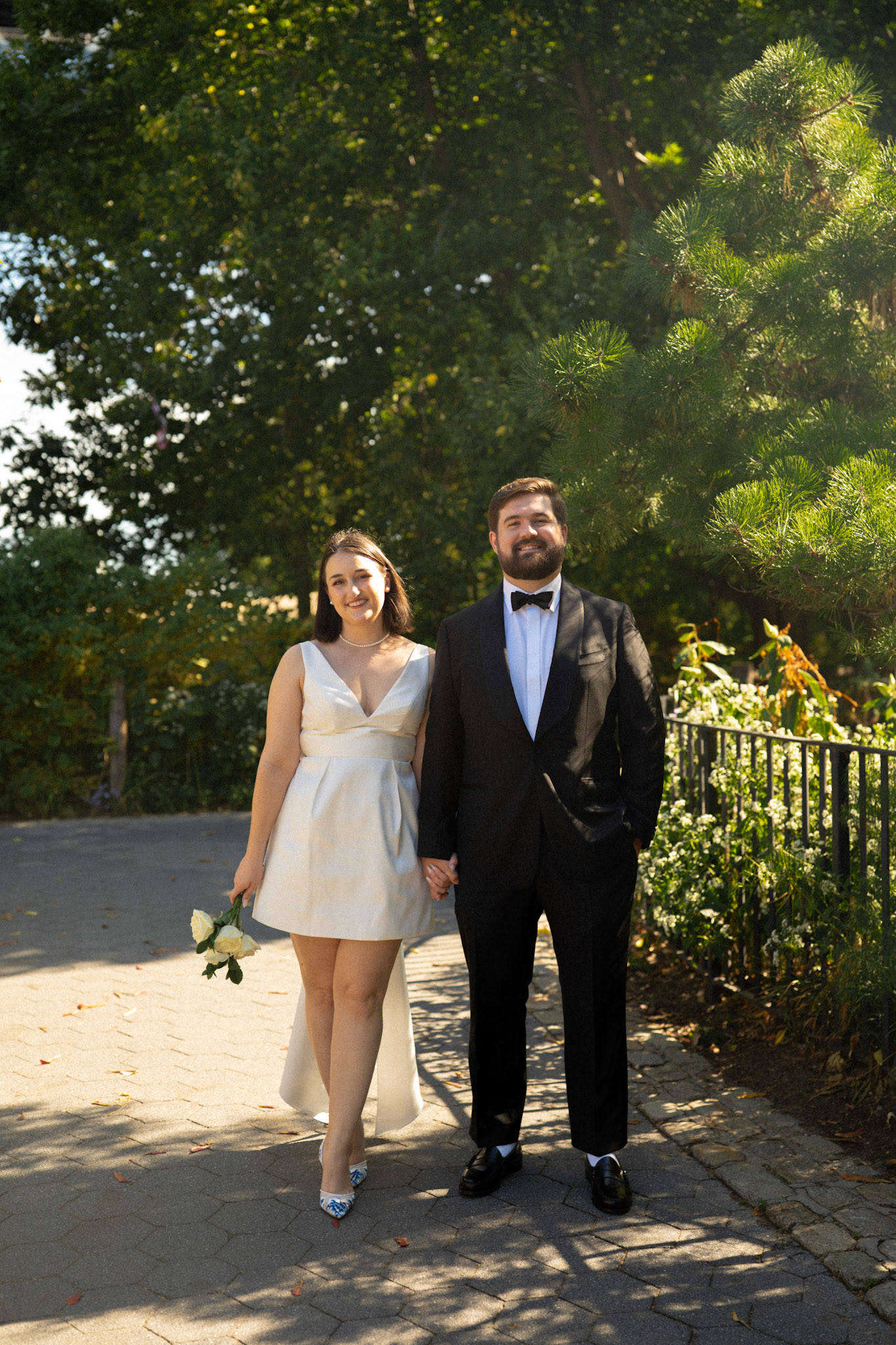 Bride & groom in DUMBO. Photo by Catherine Claire Art. 