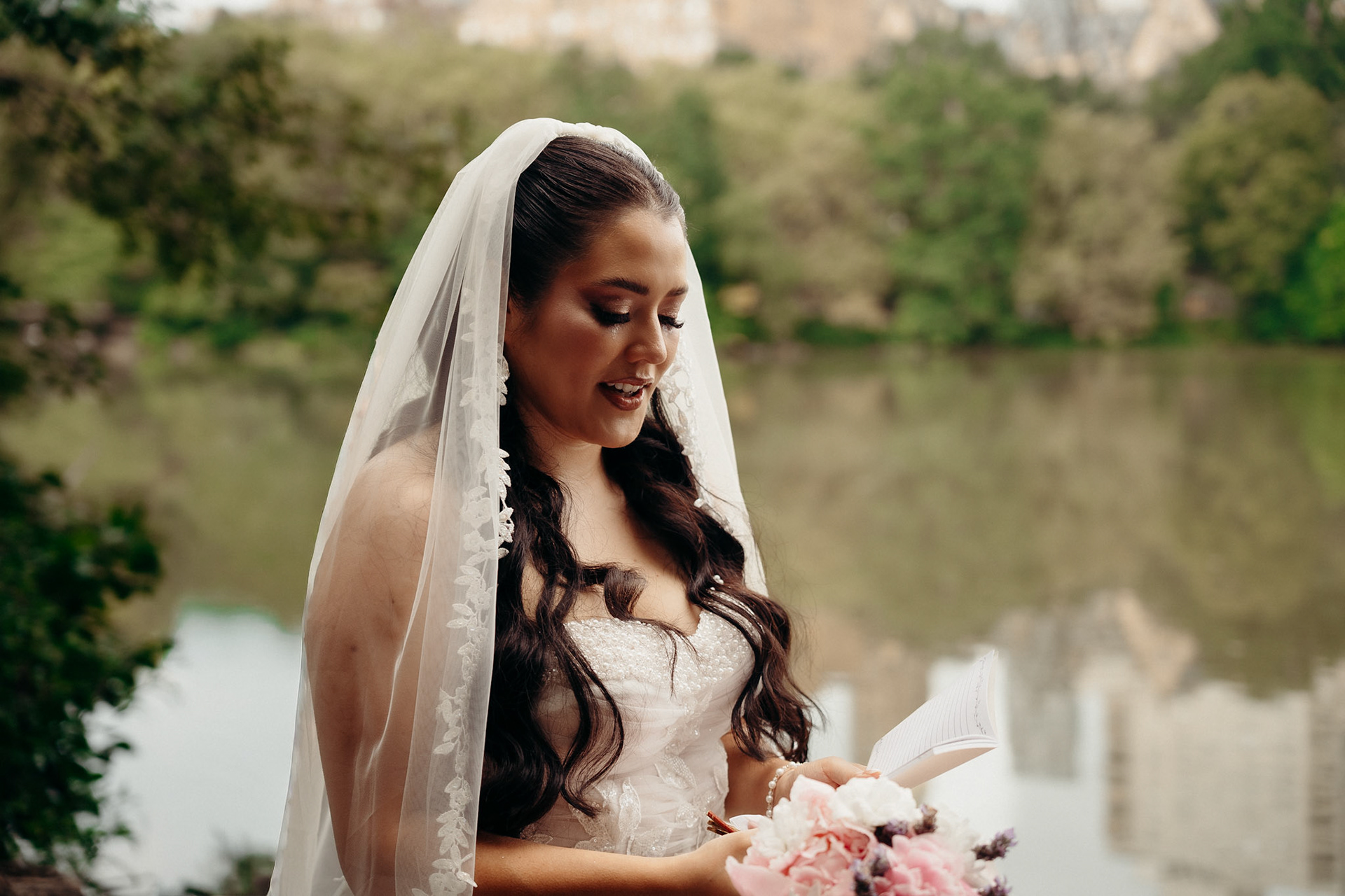 Bride reciting vows at Central Park Elopement, photographed by Catherine Claire Art. 