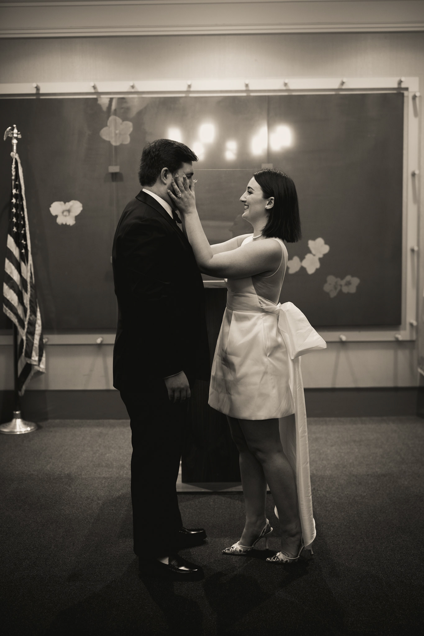 Bride & groom getting married at New York City Hall. Photograph by Catherine Claire Art.