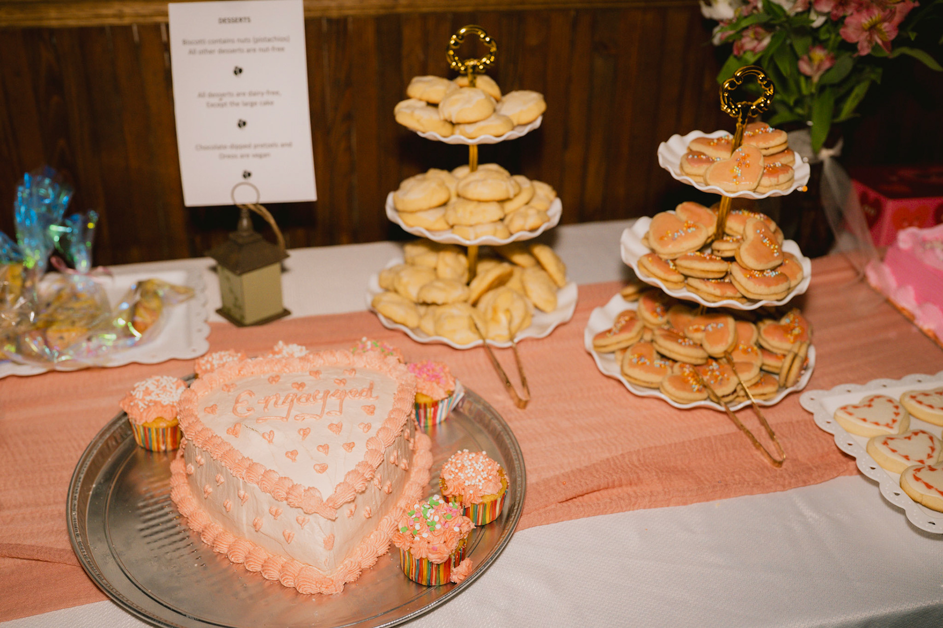 Engagement cake which reads "en-'gay'-ged"