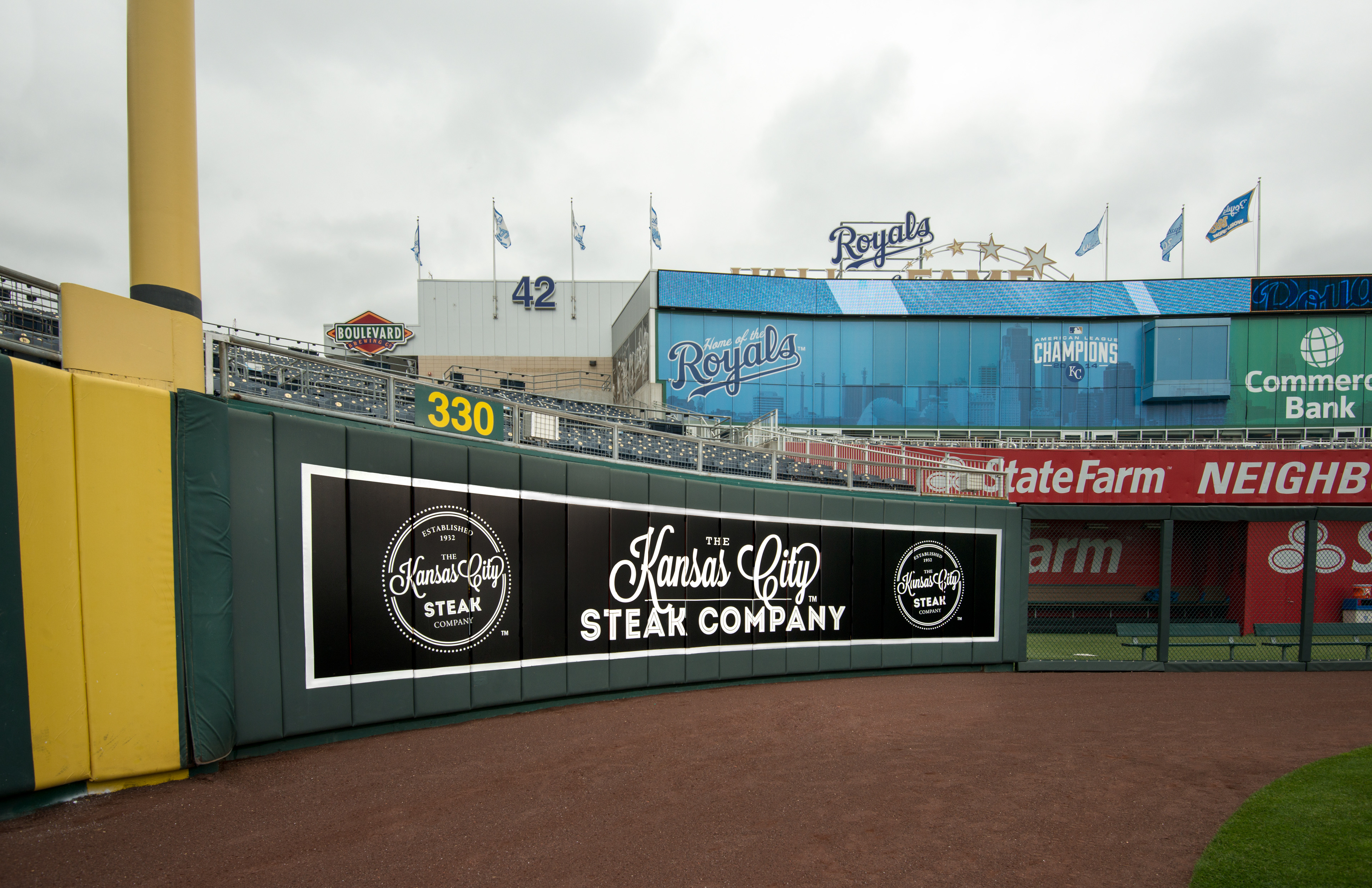 Eric Schotland designed outfield billboard for KC Steaks at KC Royals Kauffman Stadium