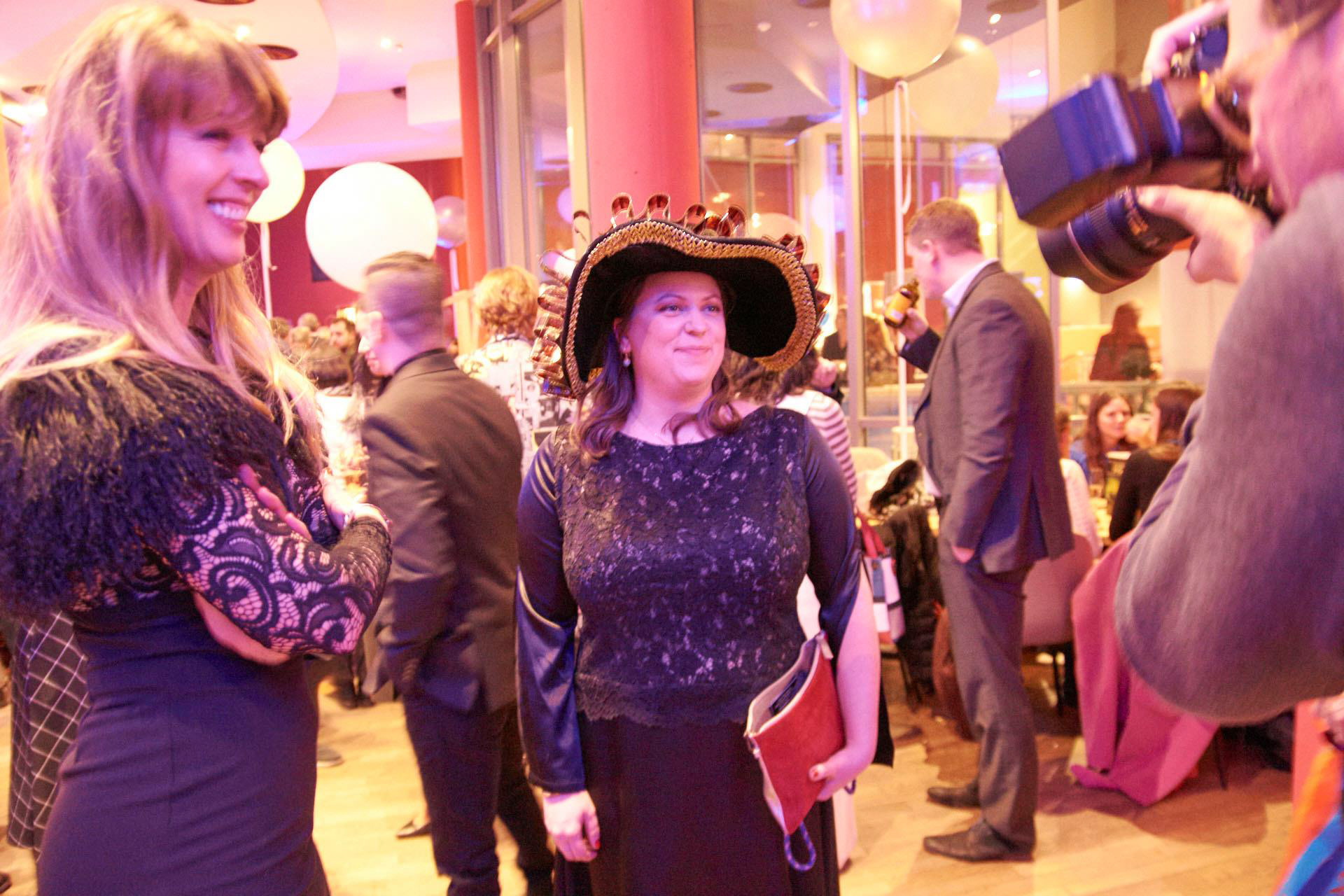 Svenja Böttger and Andrea Muller with her Festival custom hat she created at 41. FILMFESTIVAL MAX OPHÜLS PREIS Photo Andrew Wakeford