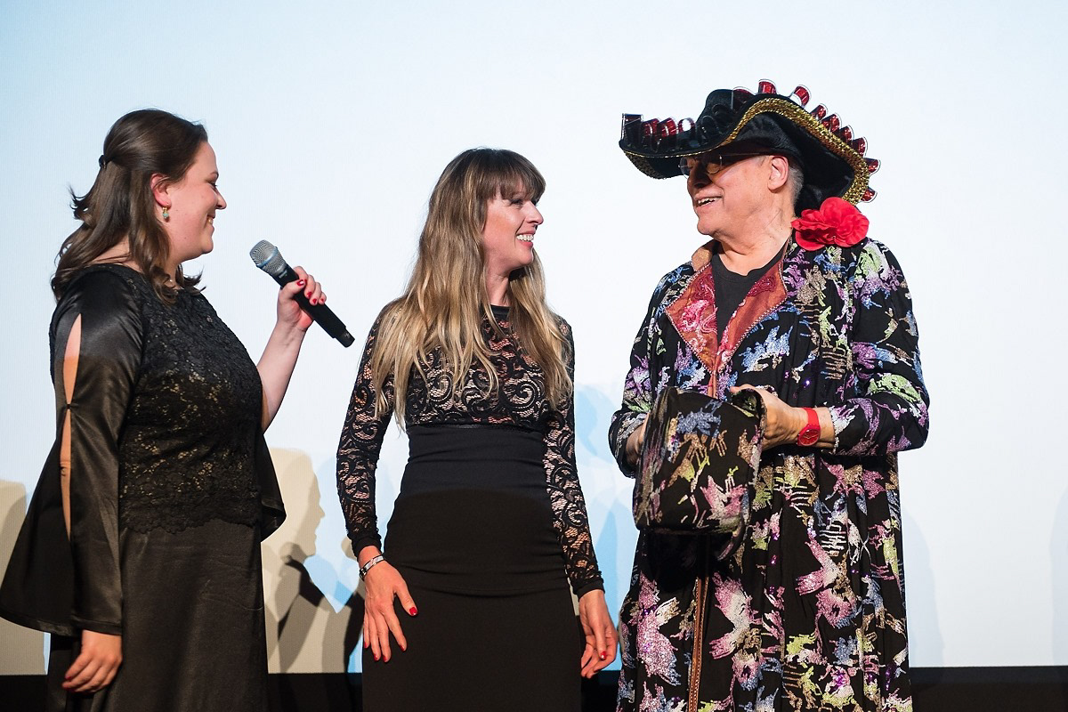 Rosa von Praunheim and Andrea Muller presenting Festival a custom hat she created at 41. FILMFESTIVAL MAX OPHÜLS PREIS Photos Oliver Dietze