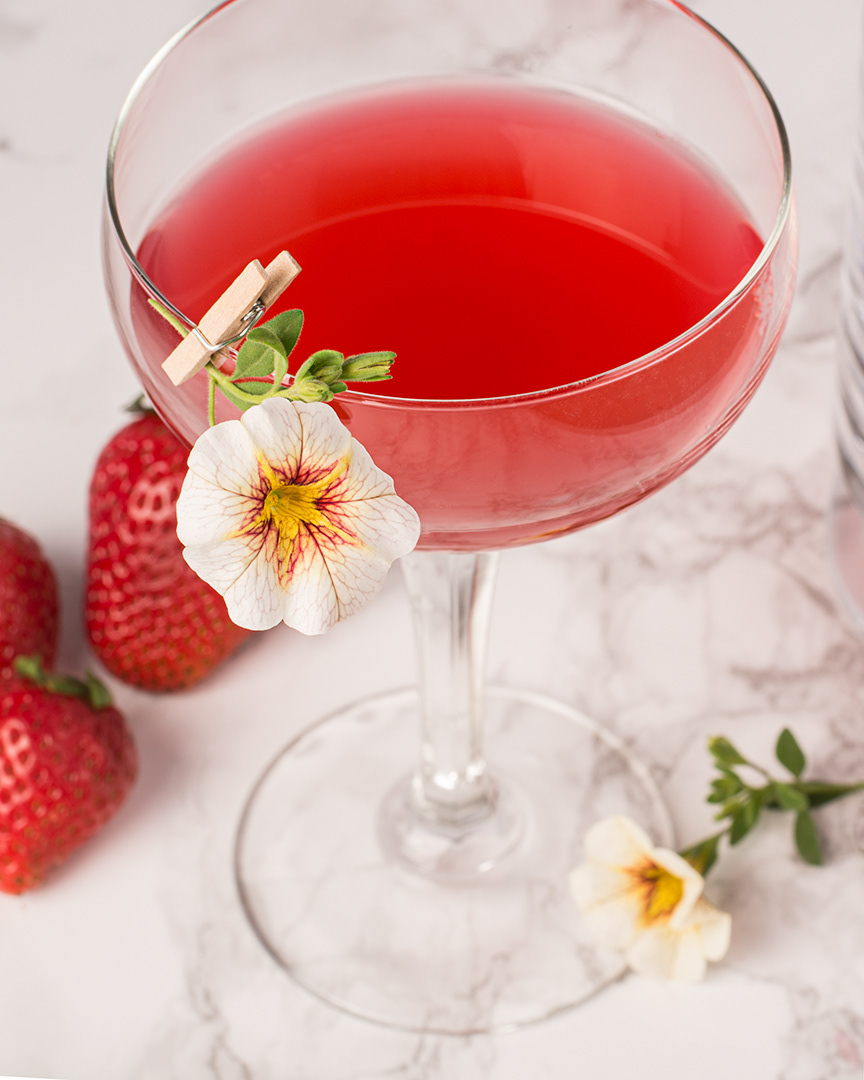 Tiny clothespin as cocktail garnish clip. Showing a simple example of how this little accessory takes a simple cocktail up a level or two. 