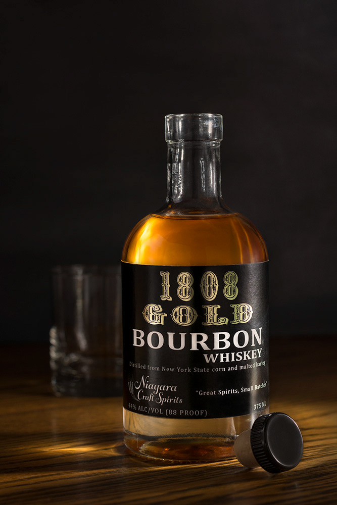 Highlighting a local craft spirit by crafting the light to give a glow to the liquid gold and capturing the reflective interest of the spot foiled label.