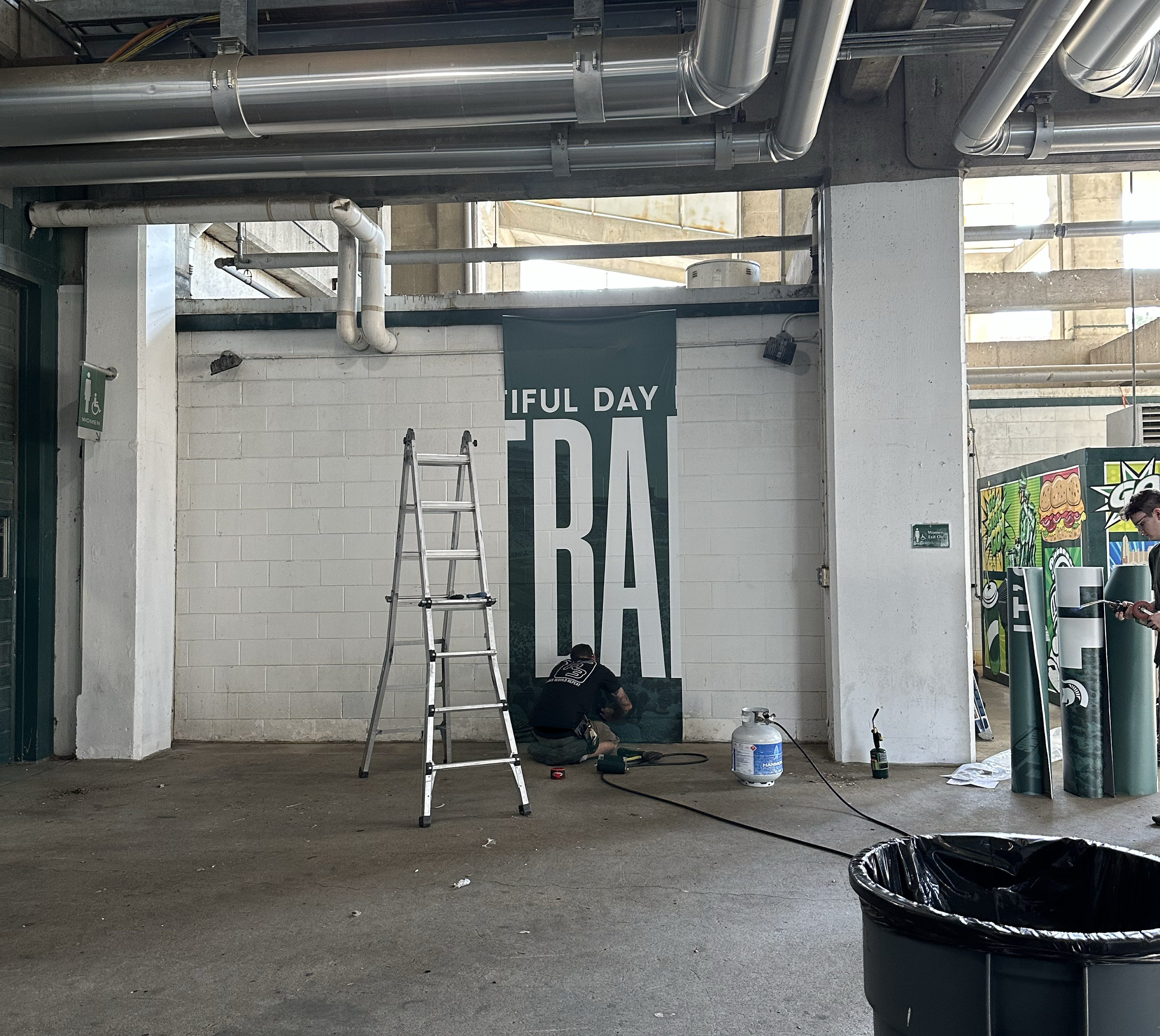 Football Student Section Mural, beginning of install