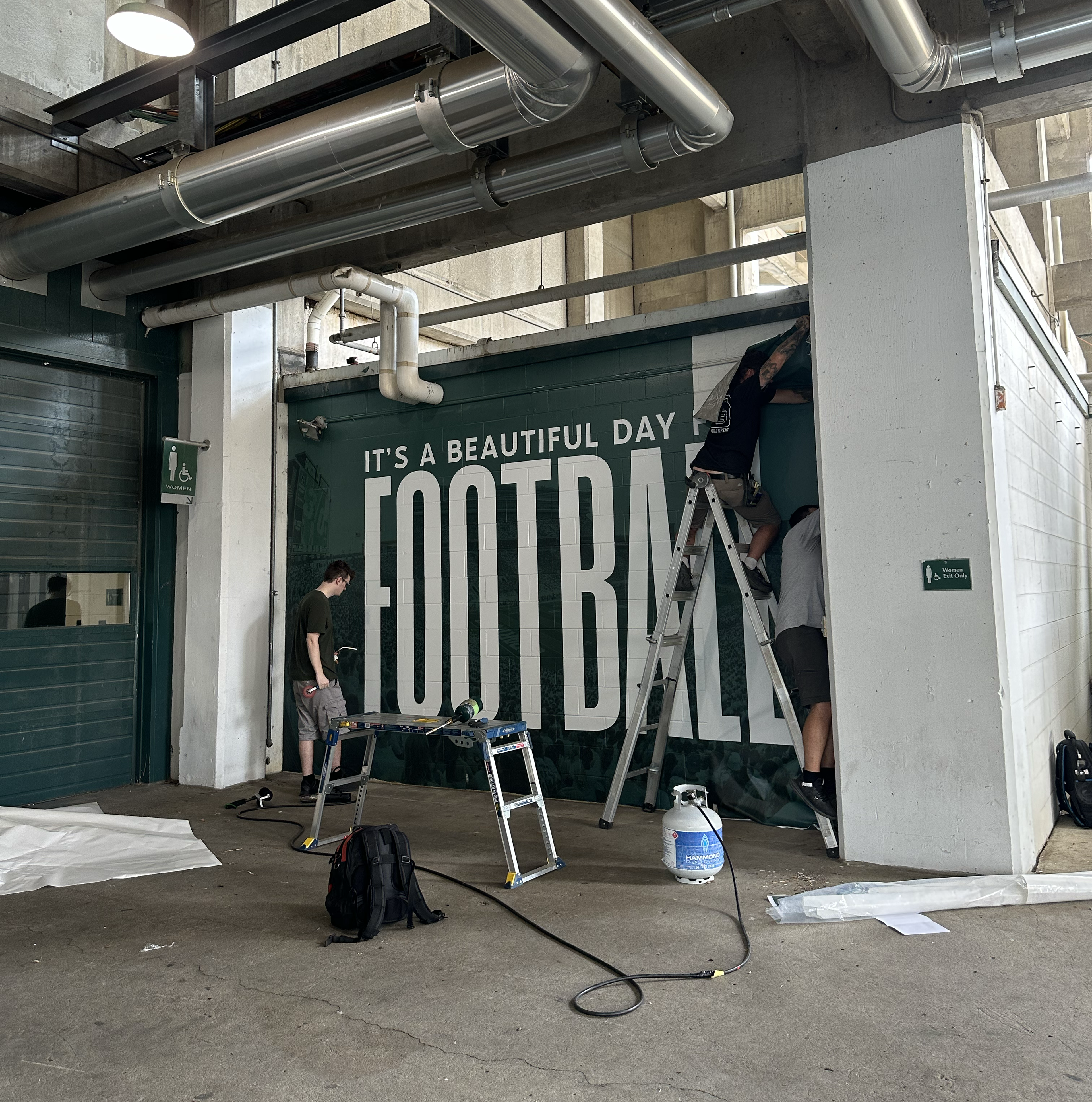 Football Student Section Mural, end of install