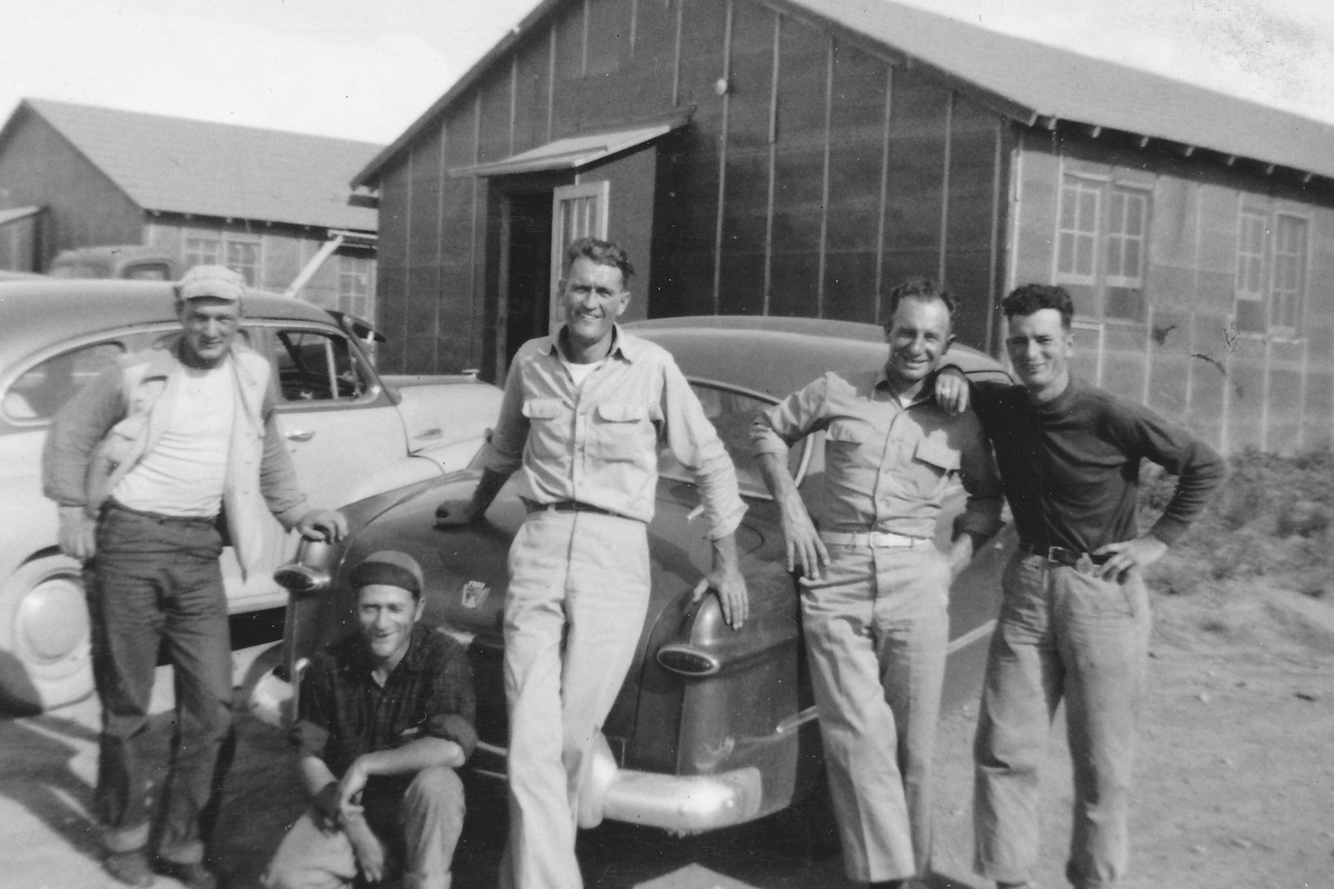 "David is on the extreme right from John - taken at work outside their quarters in N. Dakota" "David drove down there for a job but didn't get taken on, so came back home" (Garrison Dam)