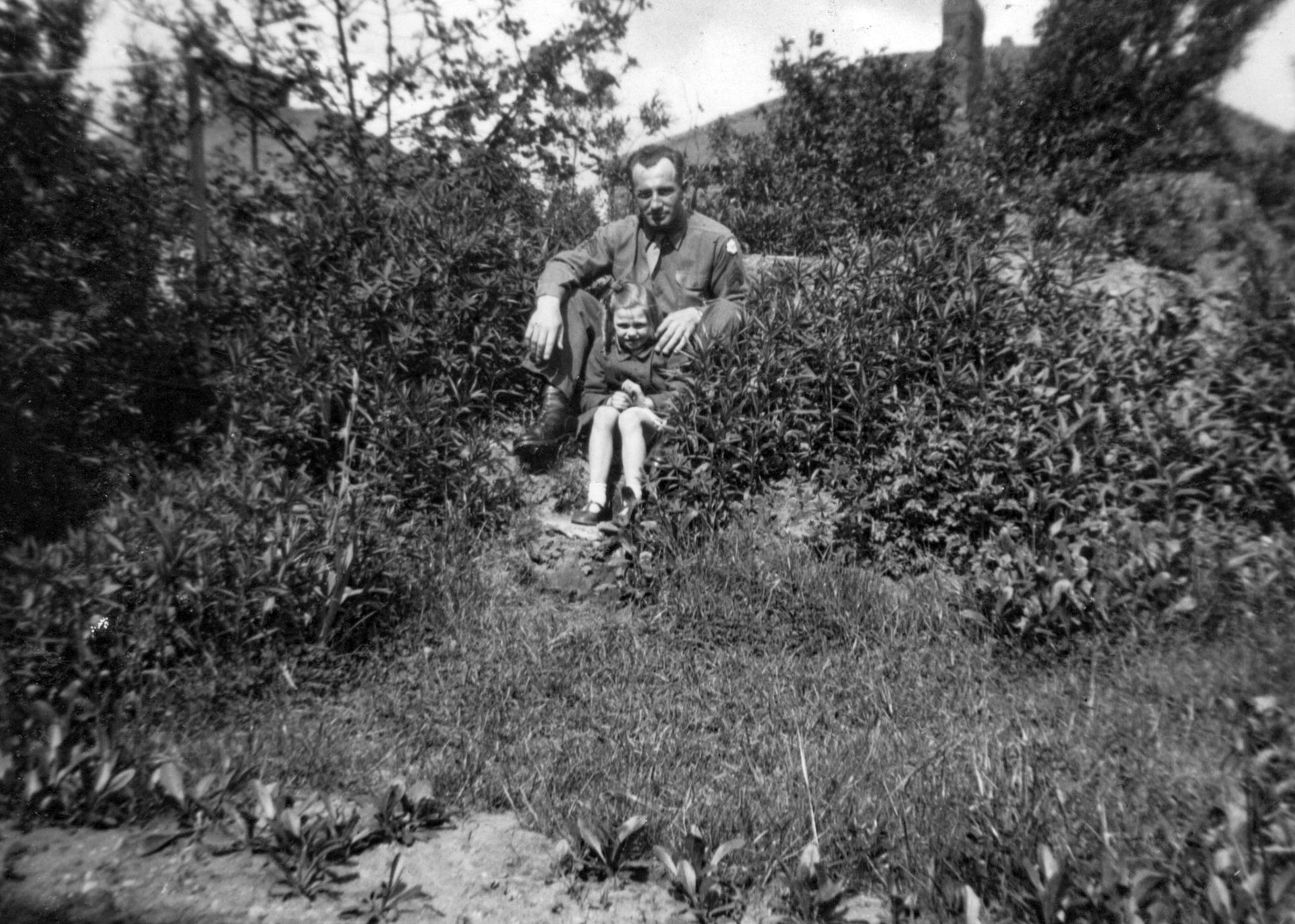 "1945 - John Orrison - Muriel Casson" (sitting on the air raid shelter at 37 Kirkstone Road)