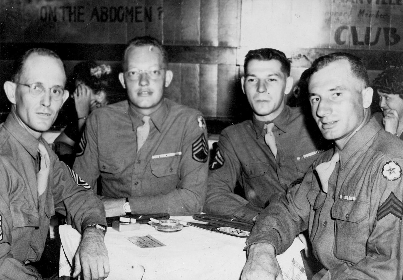 At the Nut Club - In a souvenier folder saying:
World Famous Nut Club
That made Greenwich Village famous
99 Seventh Ave., South
at Sheridan Square
In the heard of Greenwich Village
New York, N. Y.
On the back of the photo is written 1 ?, 2 John Chatly, 3 ?, 4 John S. Orrison
Dad, 1944 on the right