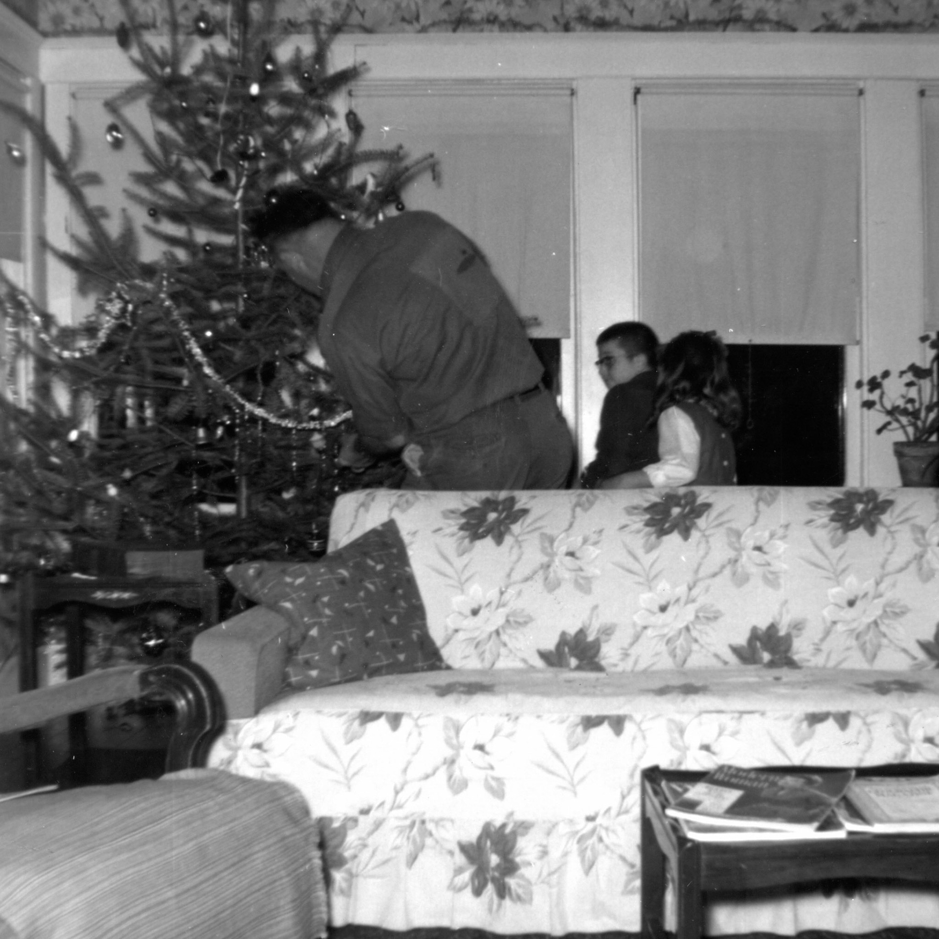 "night before Christmas trimming the tree - Joyce & Johnny helping Daddy" [Dec 1957]
