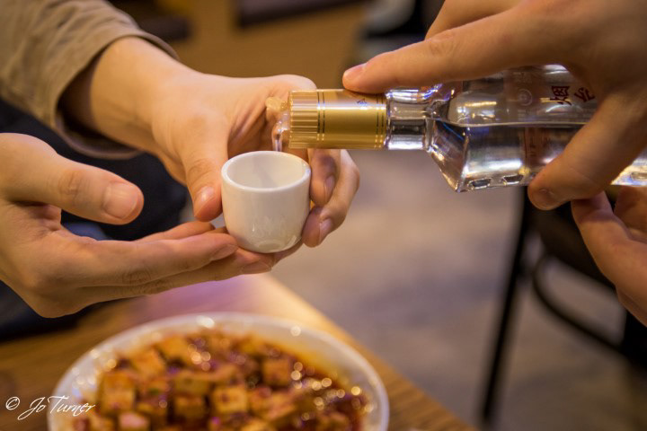 Washing it all down with Baiju 