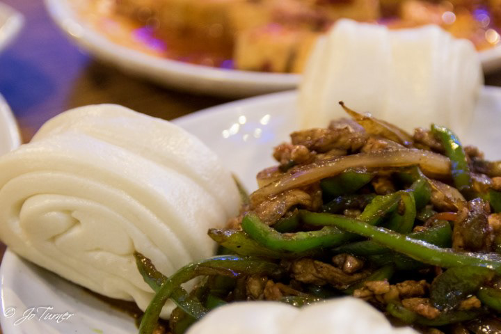 Steamed buns and veggie sides