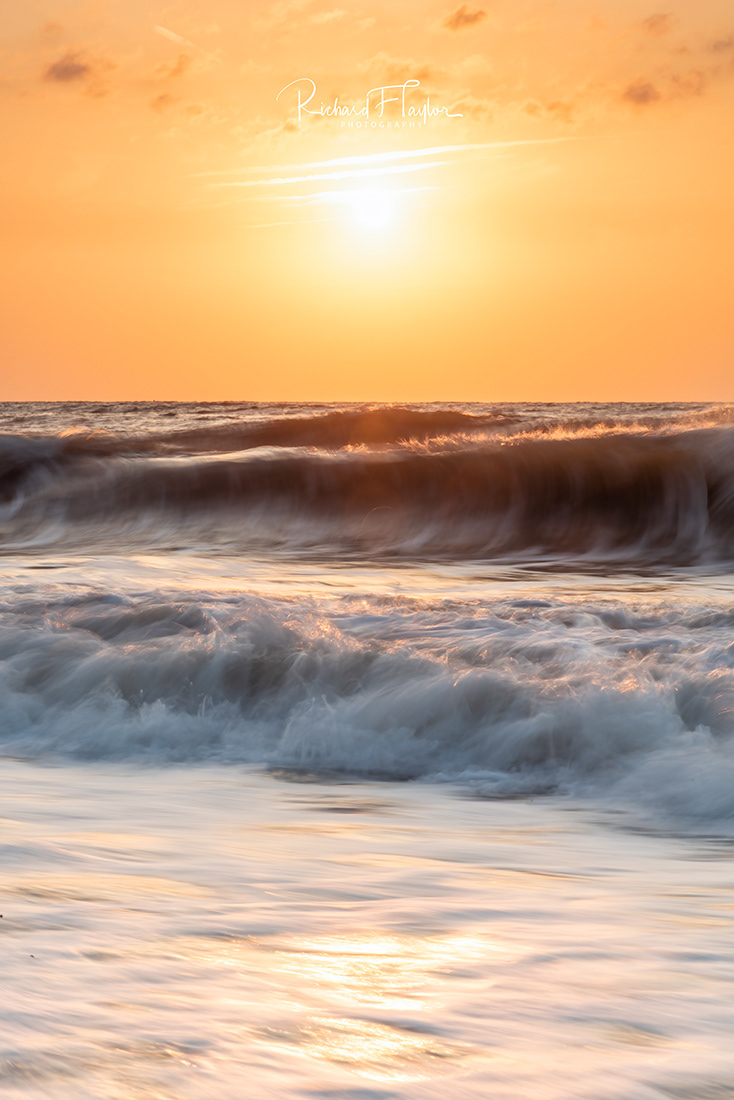 Golden Dawn: A Breathtaking Sunrise on Teignmouth Beach