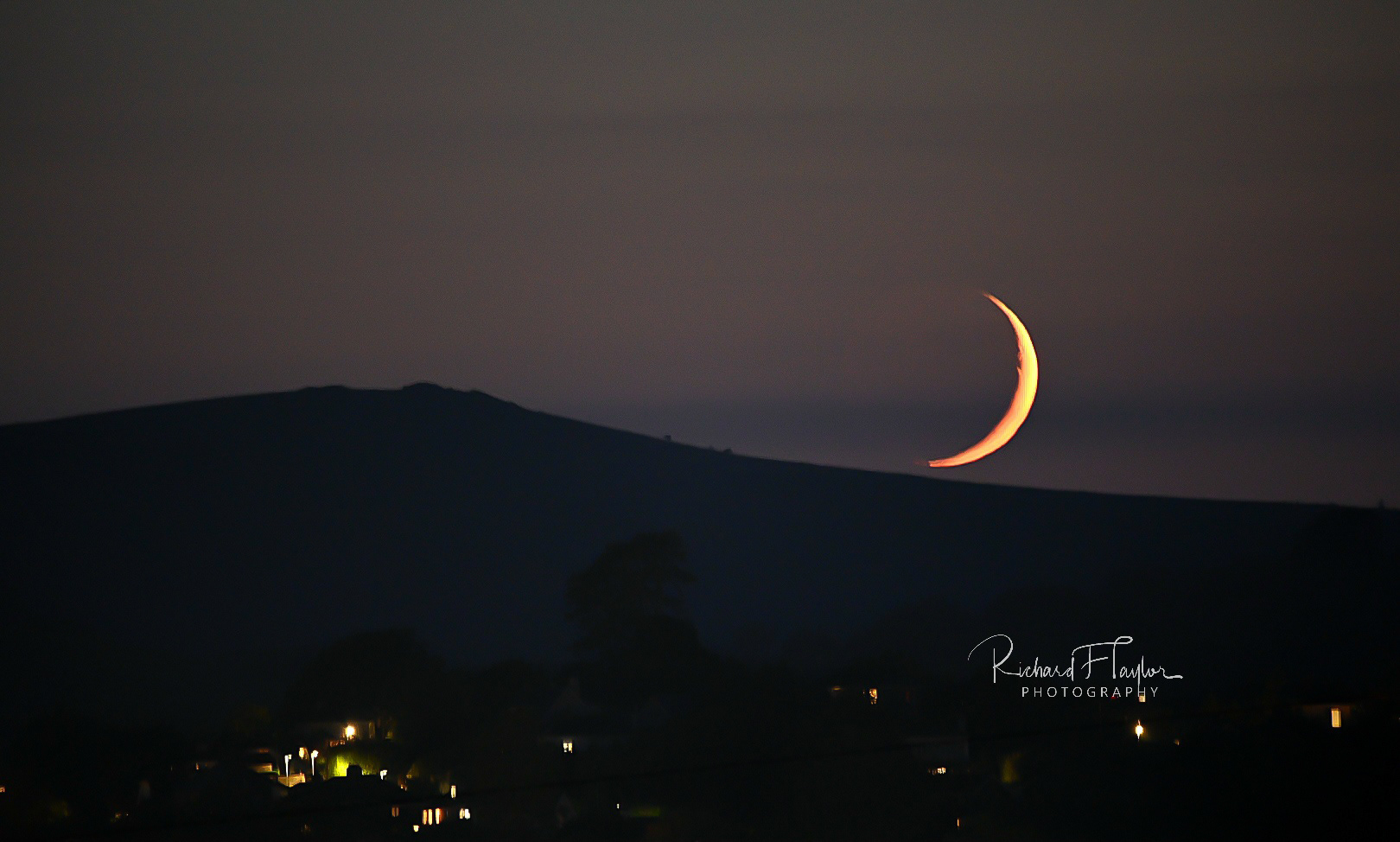 Moon setting behind Saddle Tor
