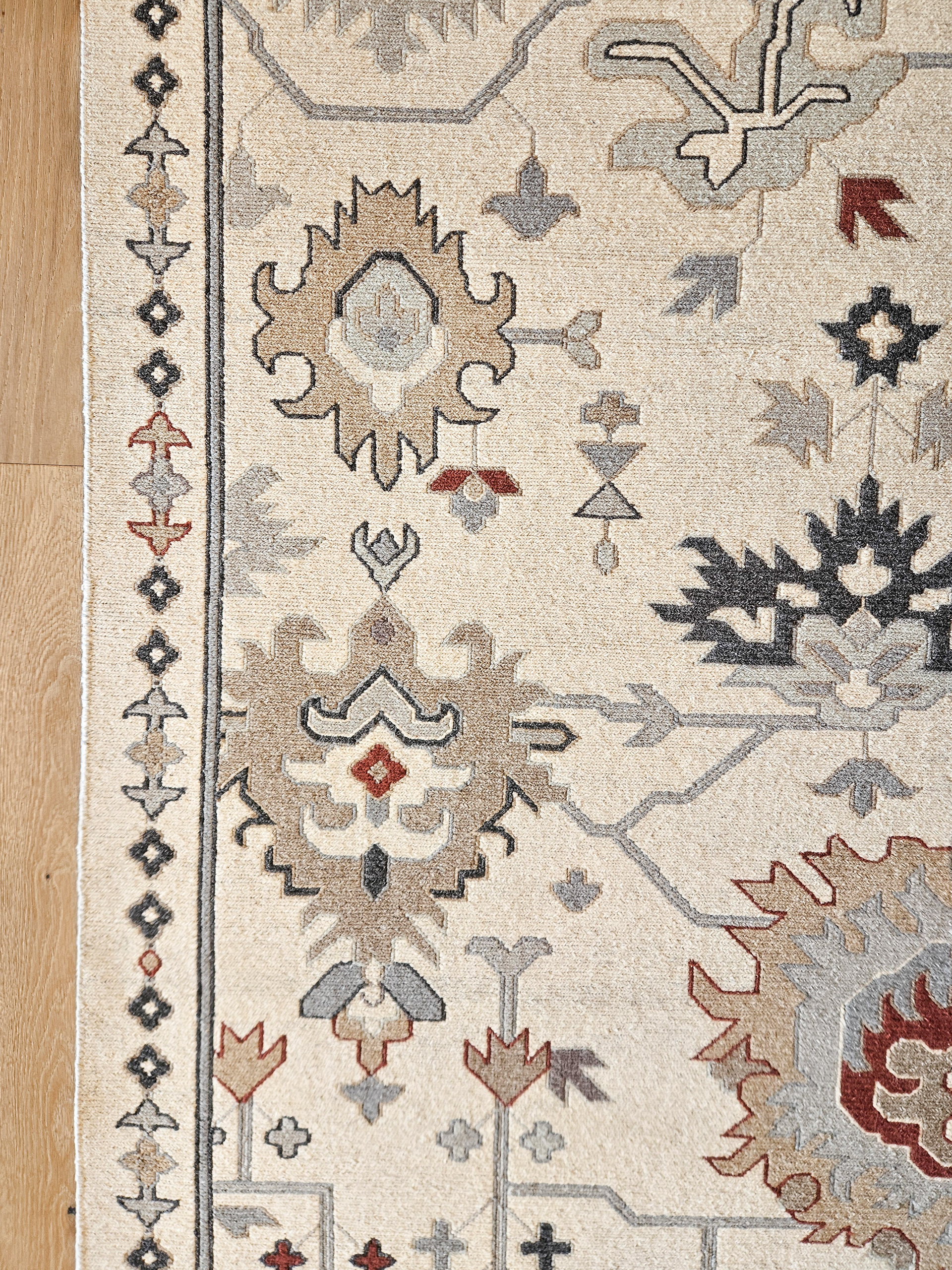 Intricate tribal motifs and geometric line work serve as the grounding, rhythmic foundation for the room’s desert inspired palette.