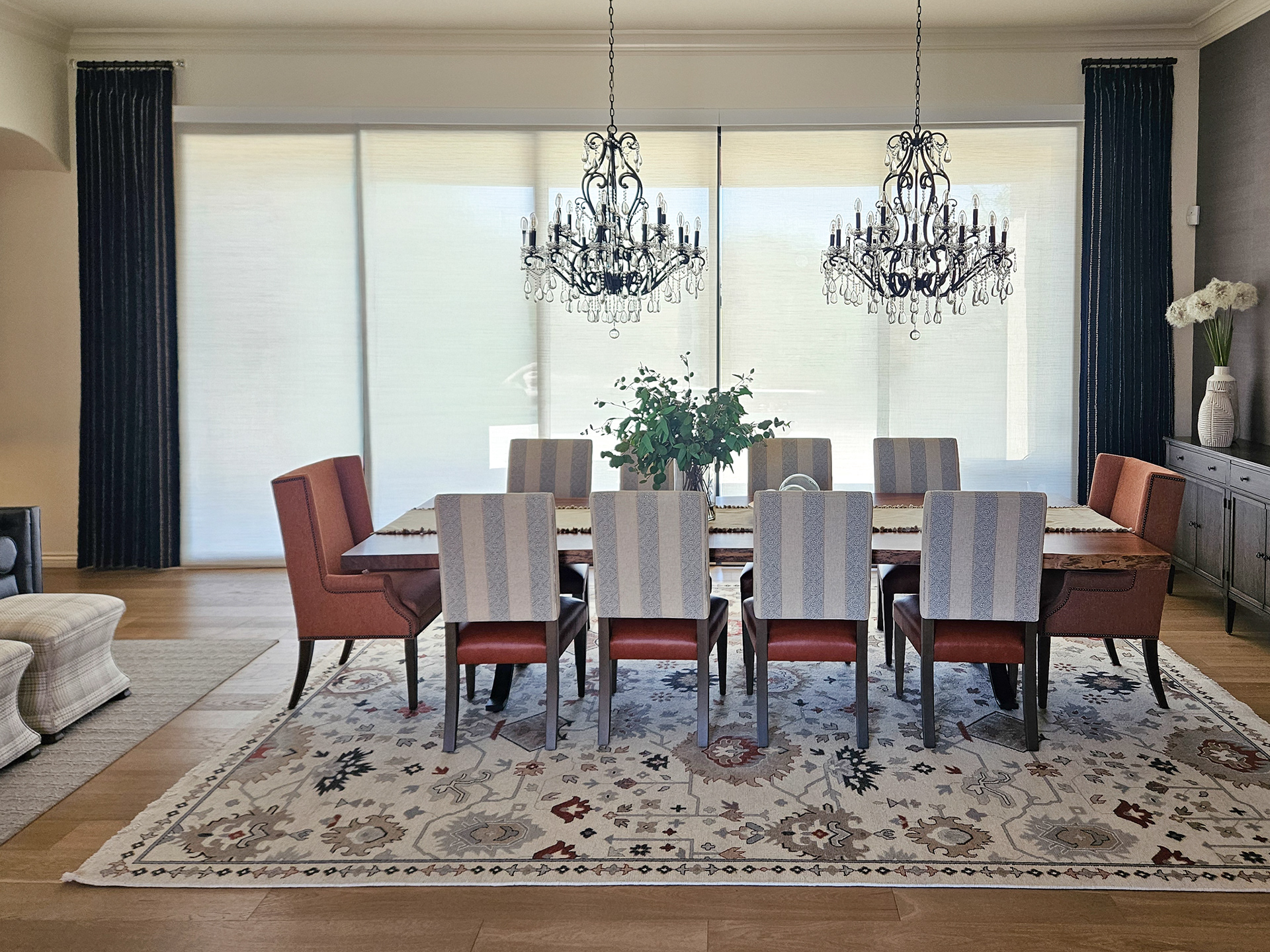 A symmetrical study in scale and light, utilizing open concept flow to bridge the dining and living environments.