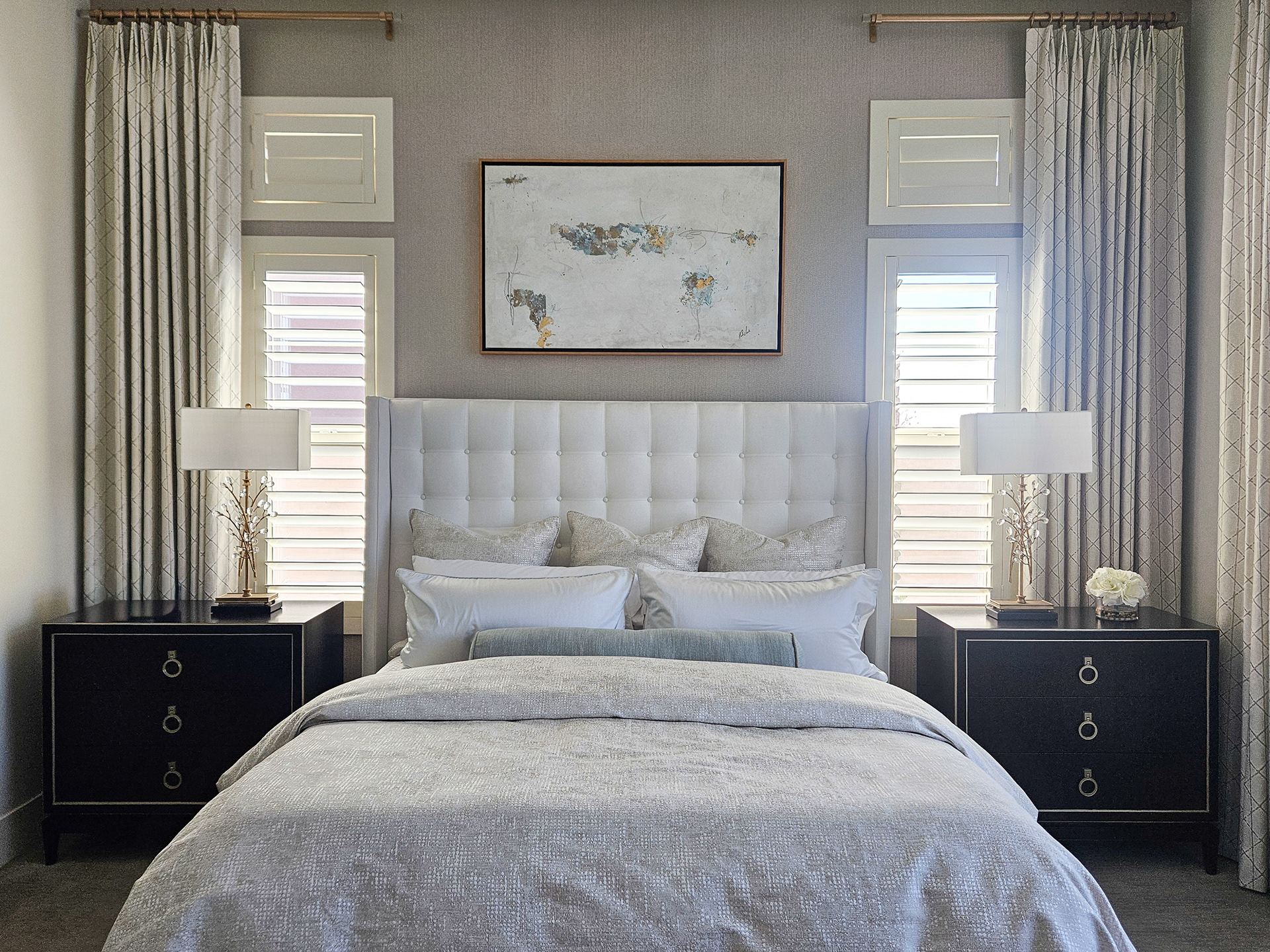 A symmetrical composition of light and texture, where radiant champagne tones frame an undeniably luxurious sanctuary.