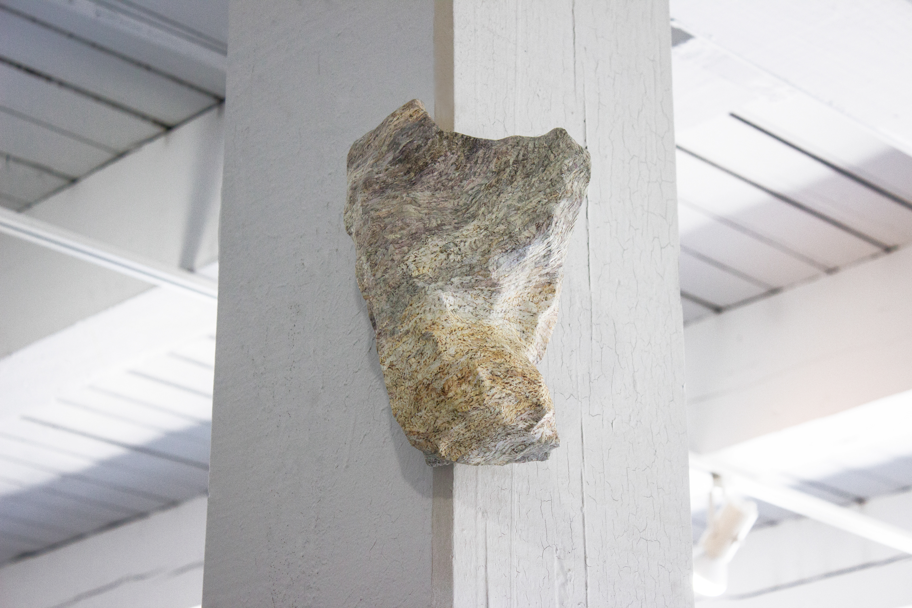 "Their Natural State" Rubble sculpture hangs on one of the gallery's columns