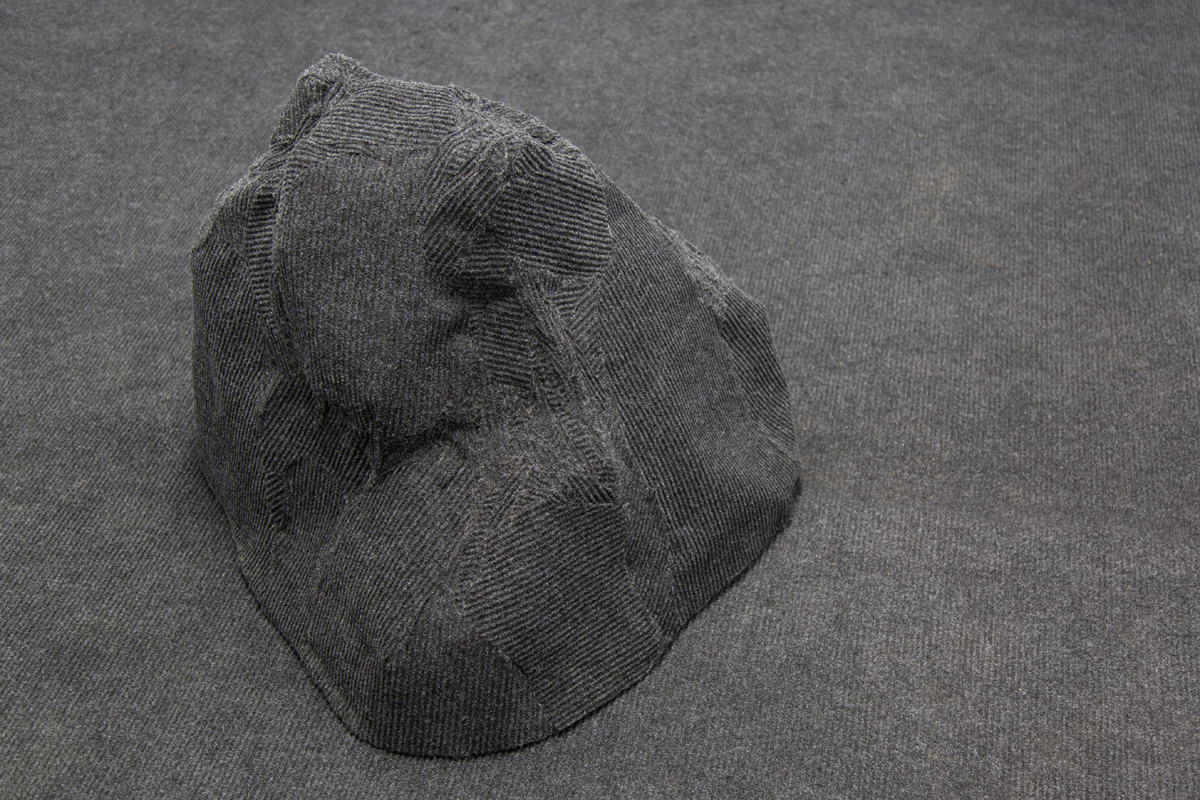 A detail shot of one of the rug boulders in the installation.