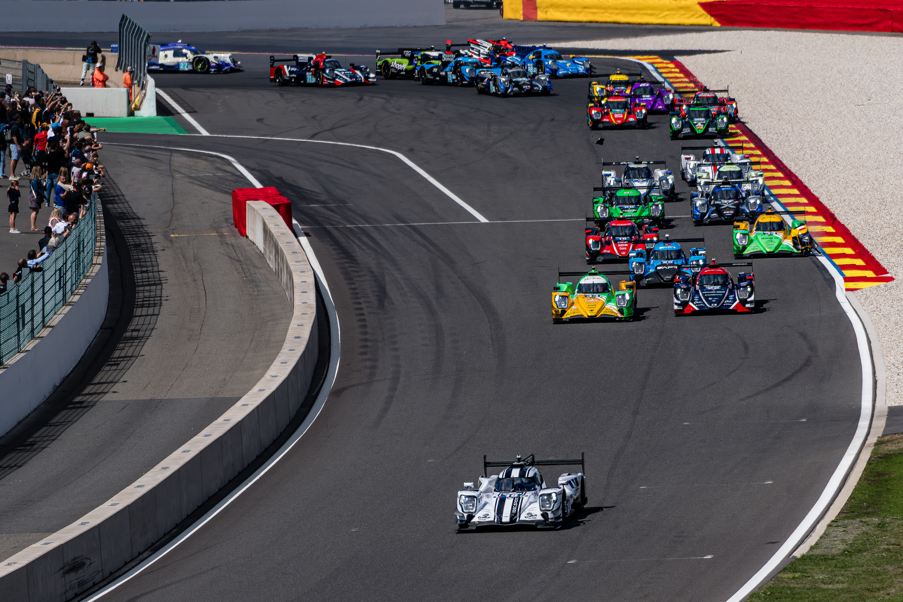LMP2 prototypes fighting for position through Turn 1 at the start of the 4 Hours of Spa-Francorchamps 2026.