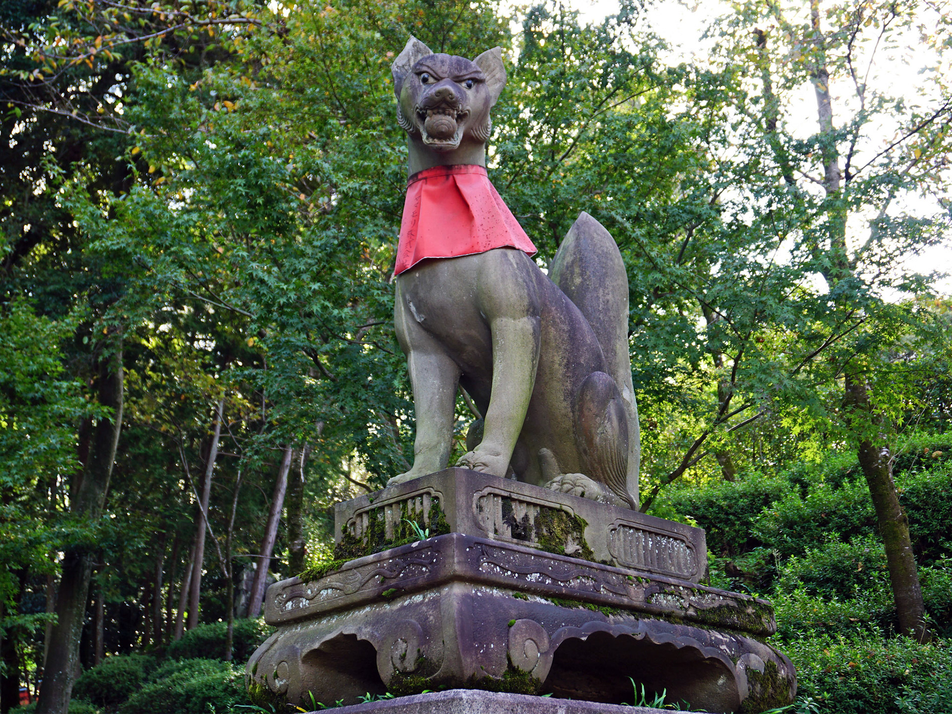 One of the many stone fox statues which are known as Inari foxes or kitsune.