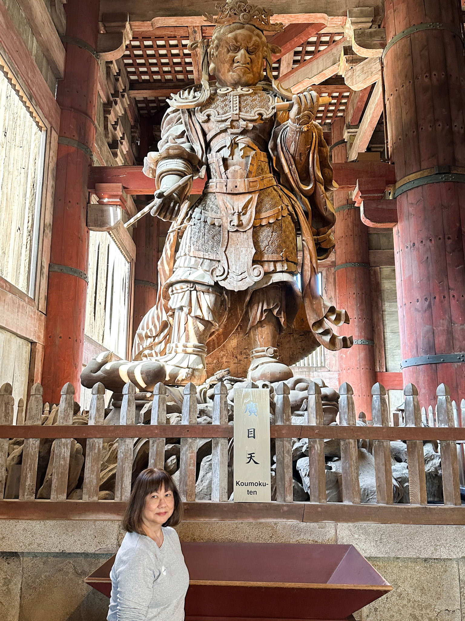 Komoku-ten, the Guardian King of the South, holding a writing brush and scroll symbolizing the copying of sutras.
