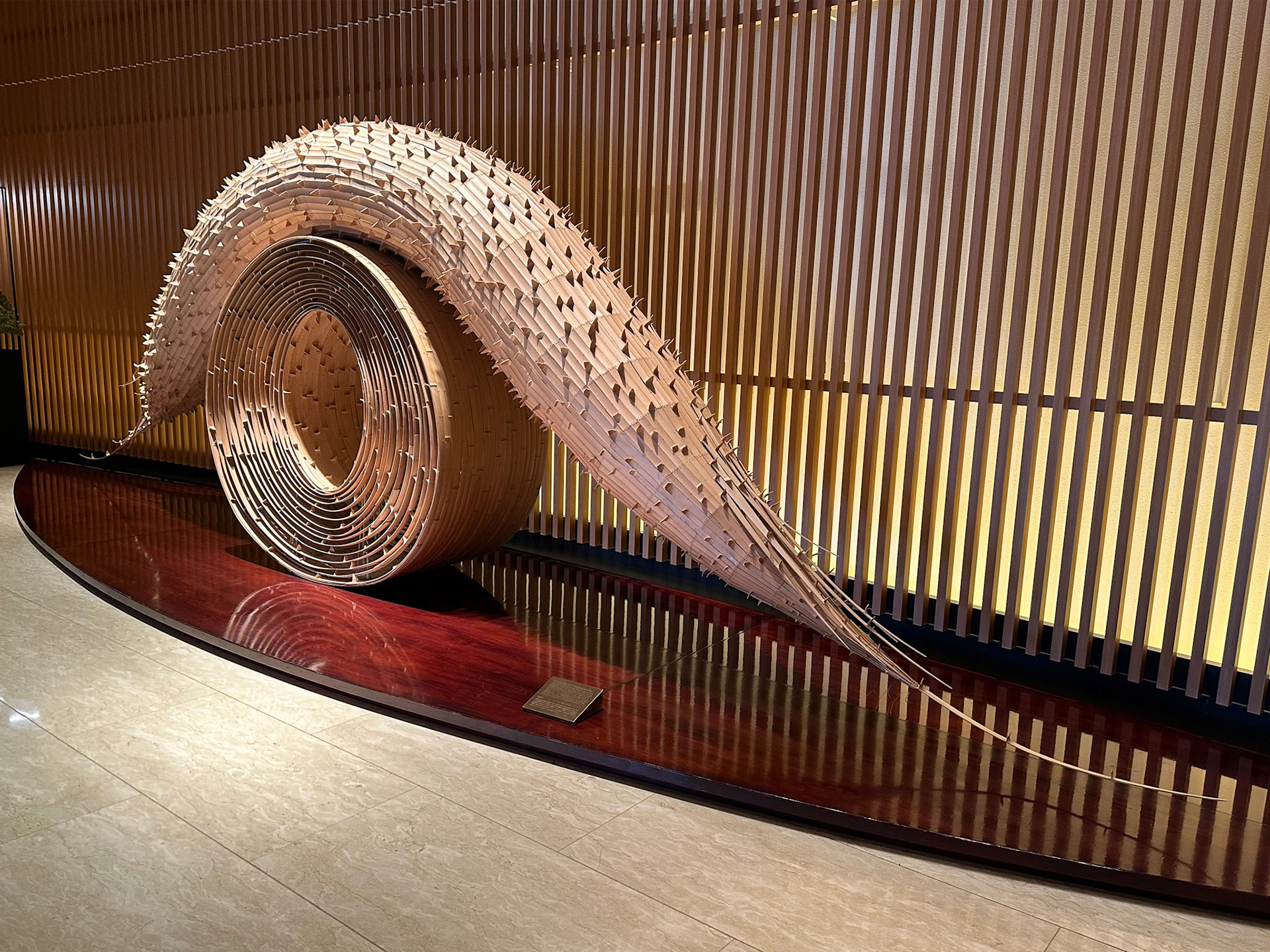 Large piece of art constructed entirely of thin slices of bamboo