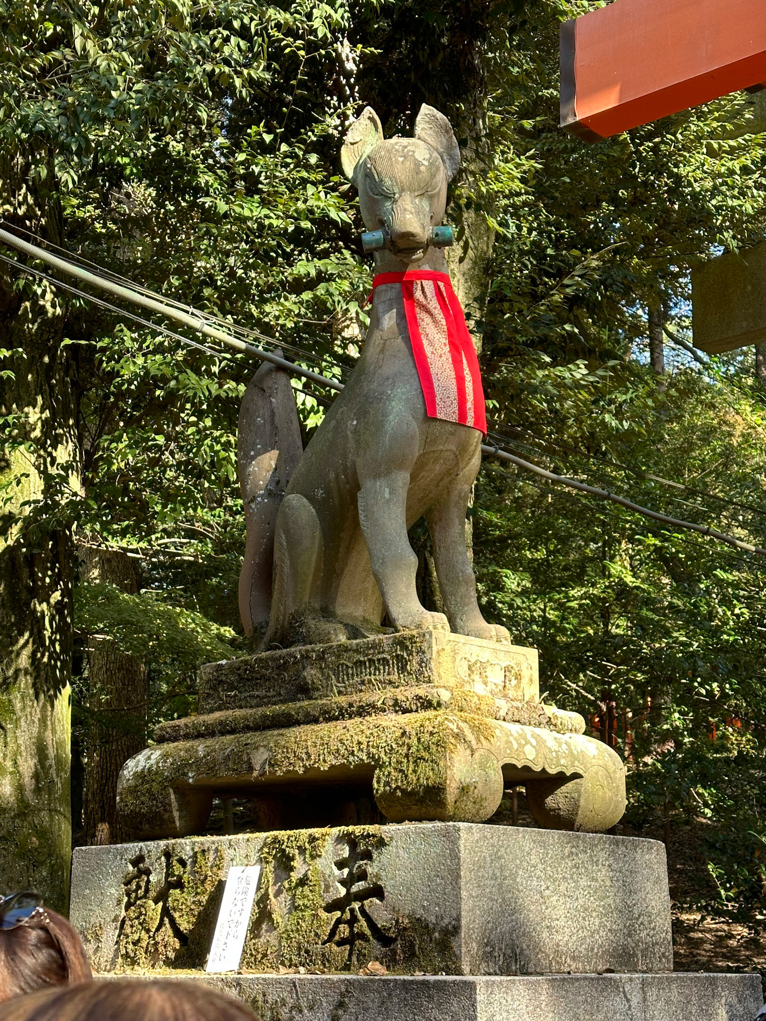 One of the many stone fox statues which are known as Inari foxes or kitsune.