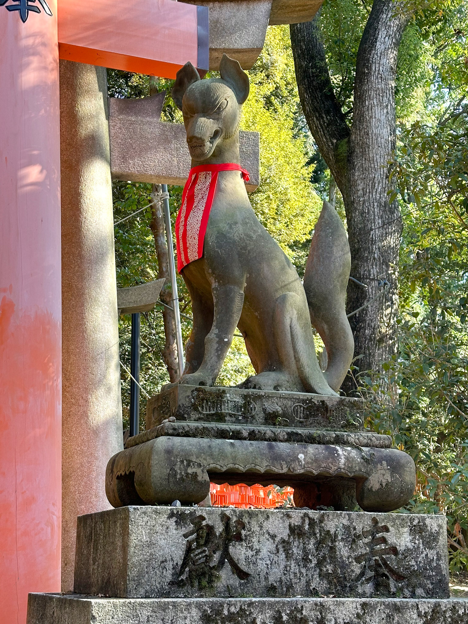 One of the many stone fox statues which are known as Inari foxes or kitsune.