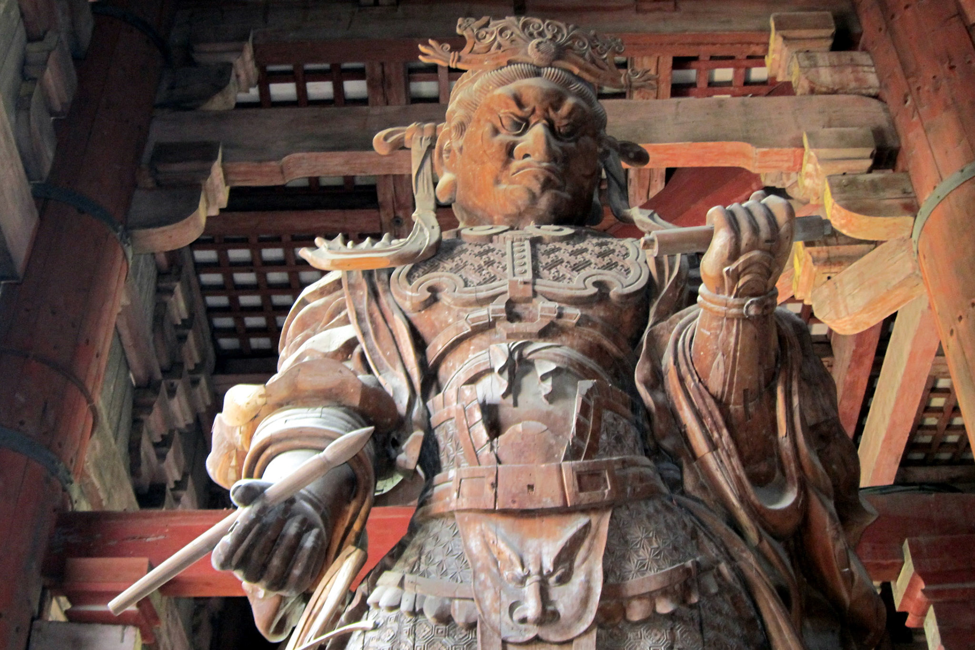 Komoku-ten, the Guardian King of the South, holding a writing brush and scroll symbolizing the copying of sutras.