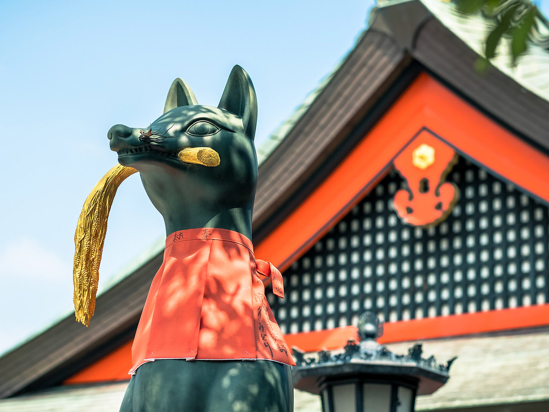 One of the many stone fox statues which are known as Inari foxes or kitsune.