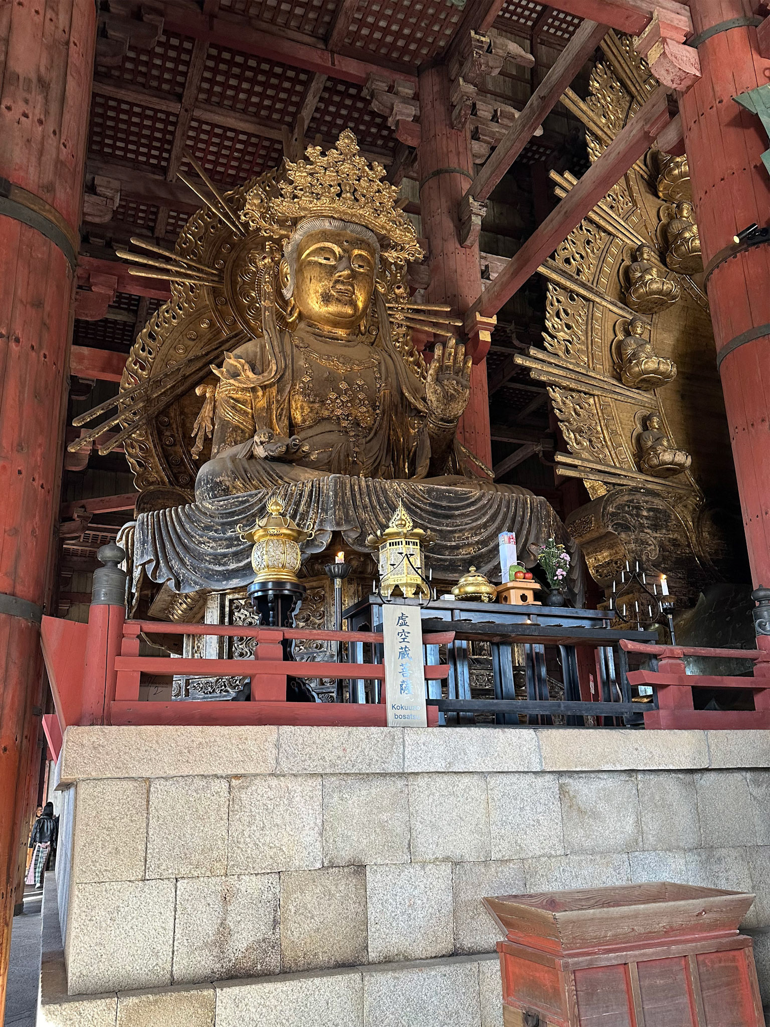 A Bodhisattva, a servant of the main Buddha. There is one of these statues on either side of the Daibutsu.