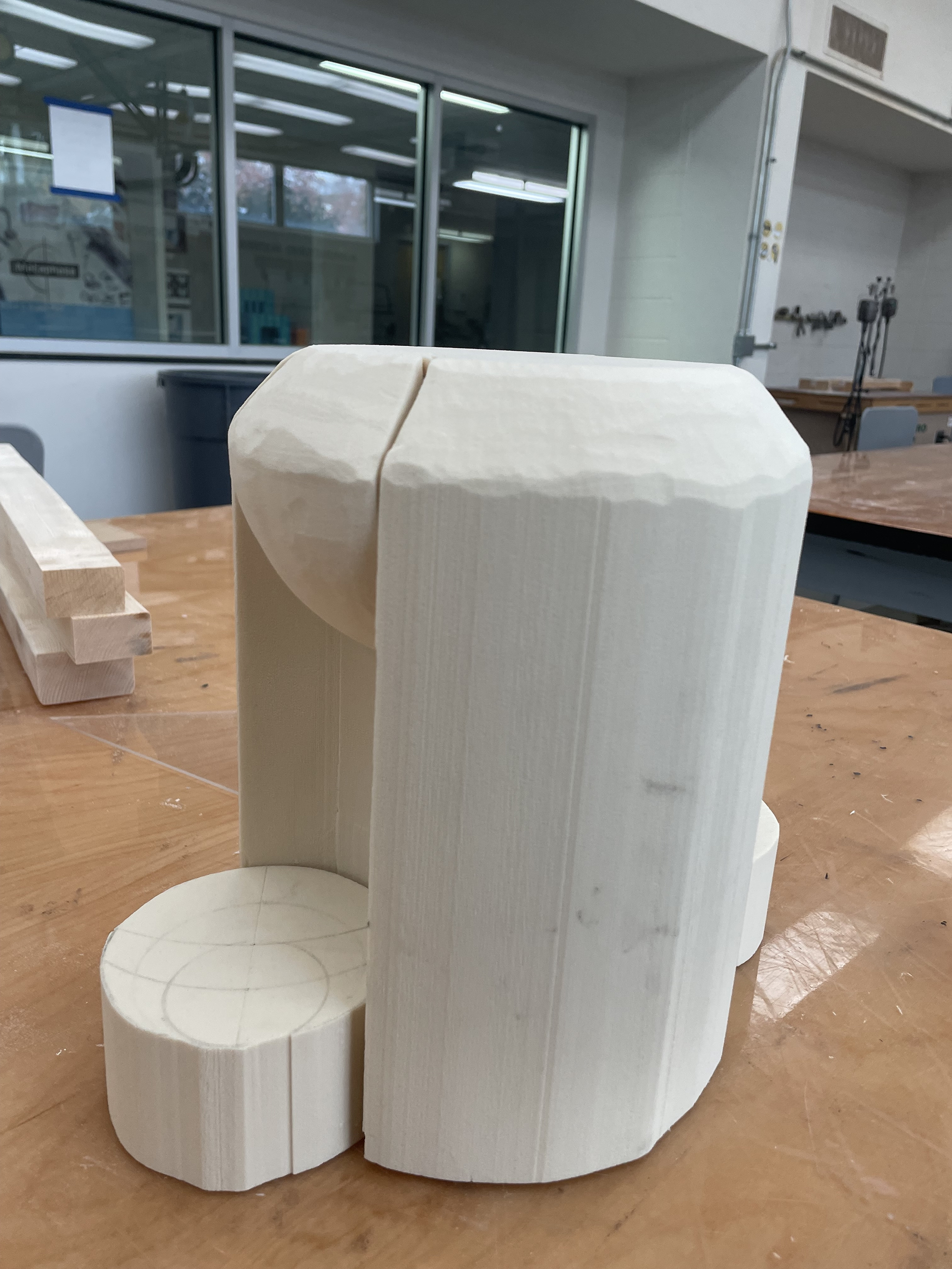 rough shaping of yellow foam using bandsaw