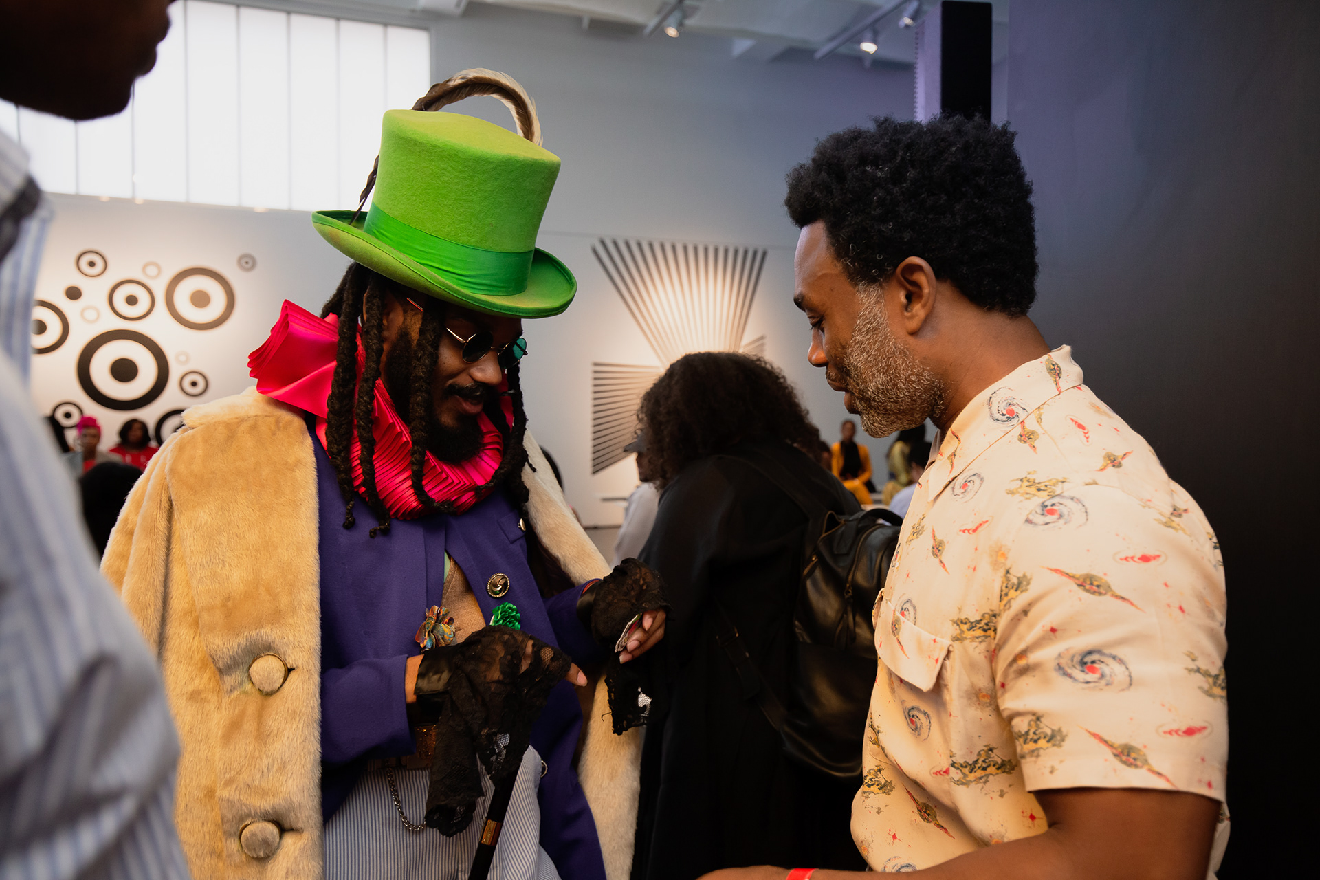 Legend being greeted by Ouigi Theodore