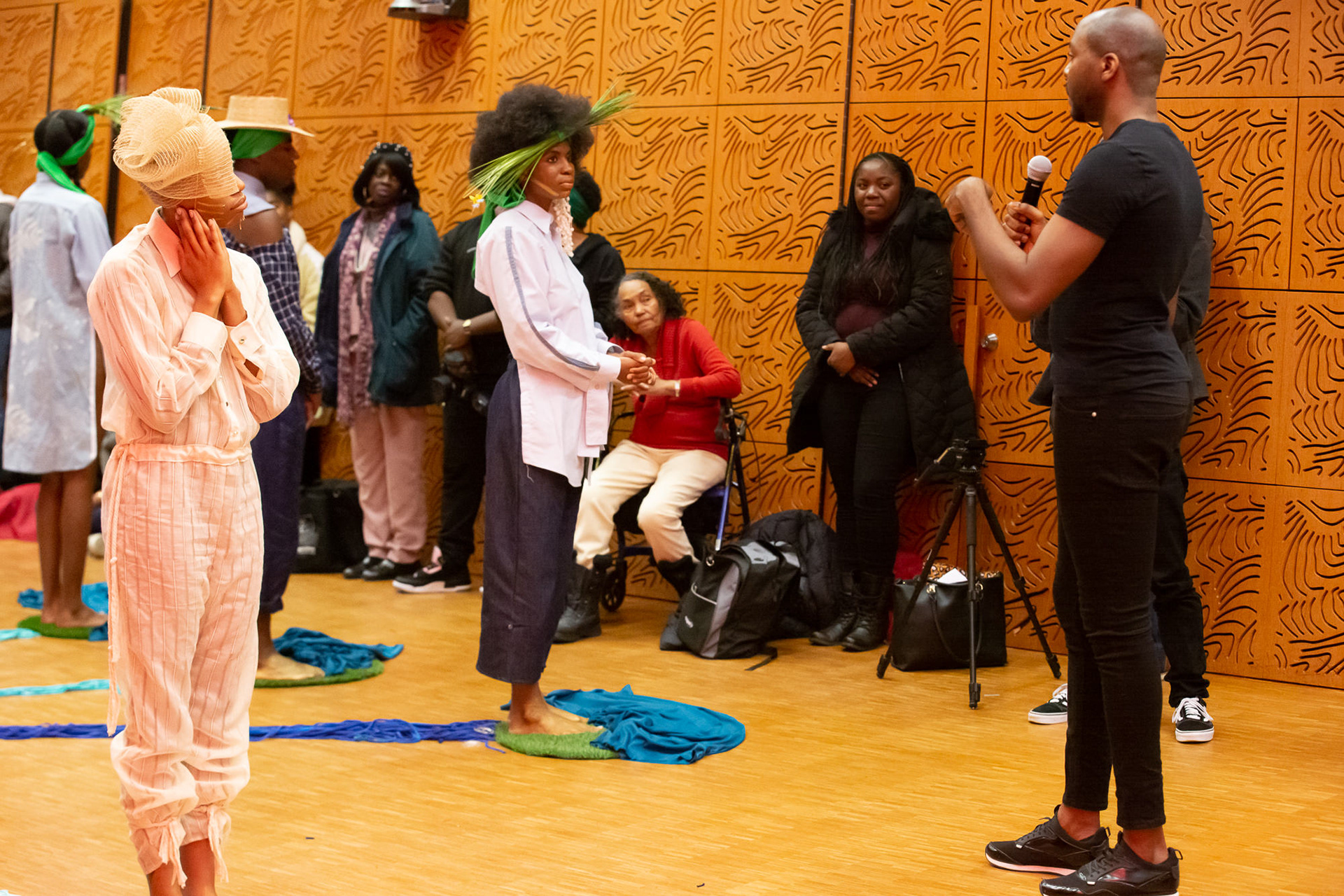 D.J. speaking to audience surrounding models