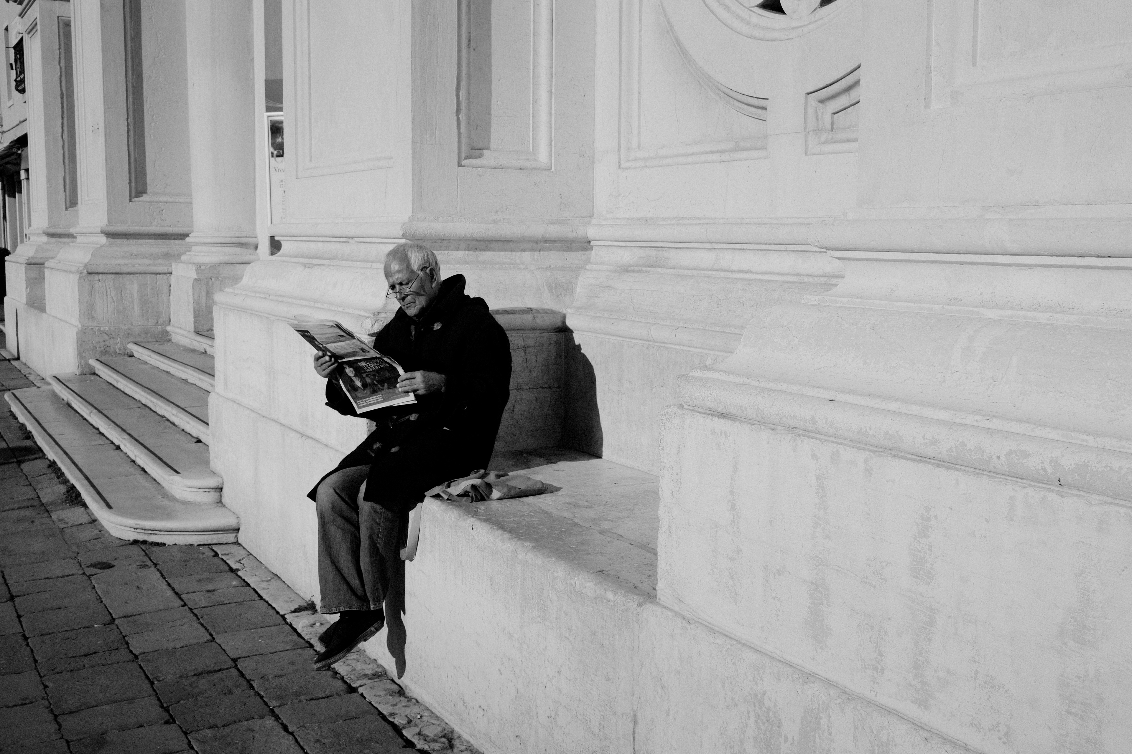 Newspaper being read. Venice, Italy 2025