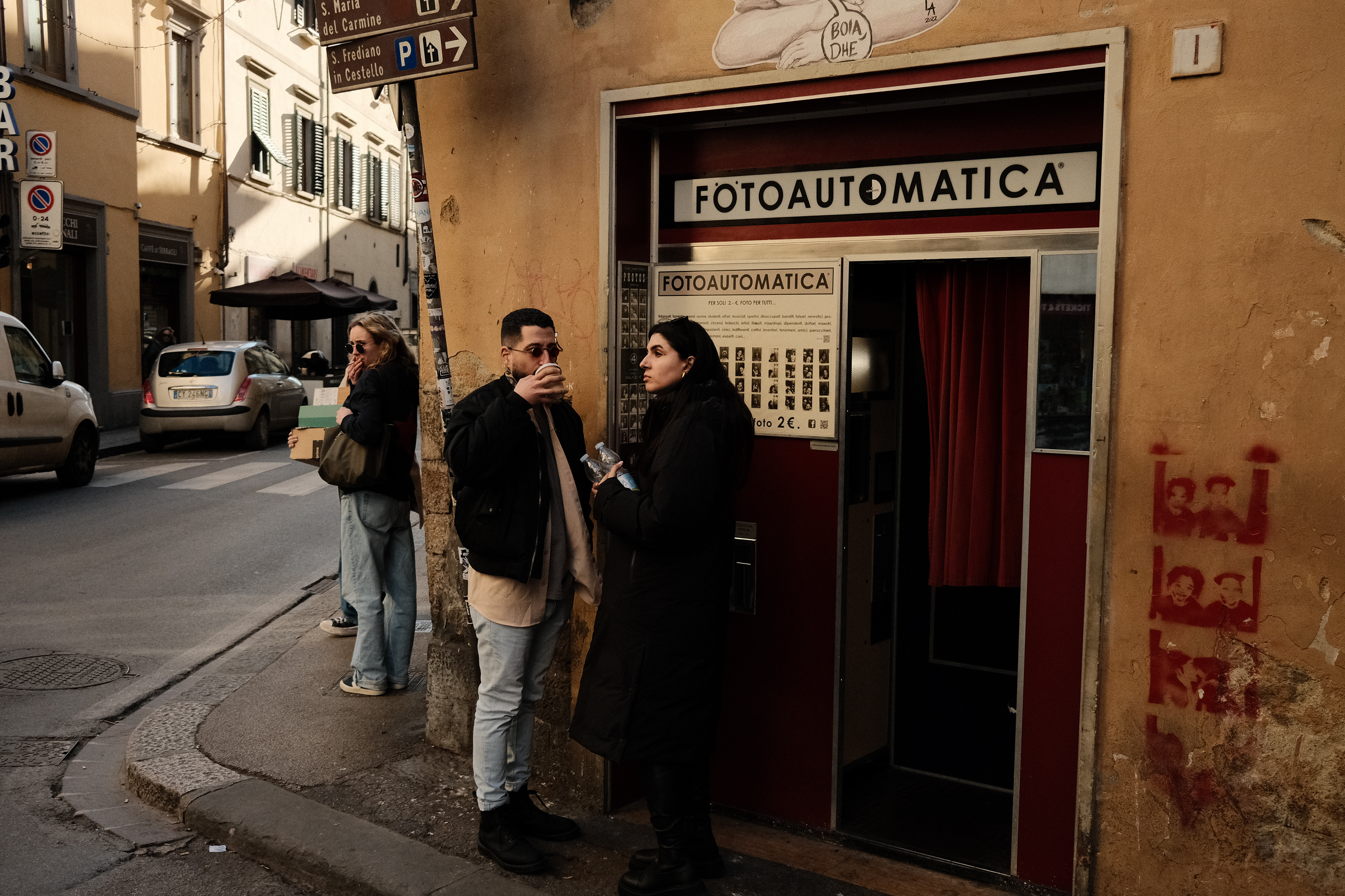 People in front of a photo machine. Florence, Italy 2024.