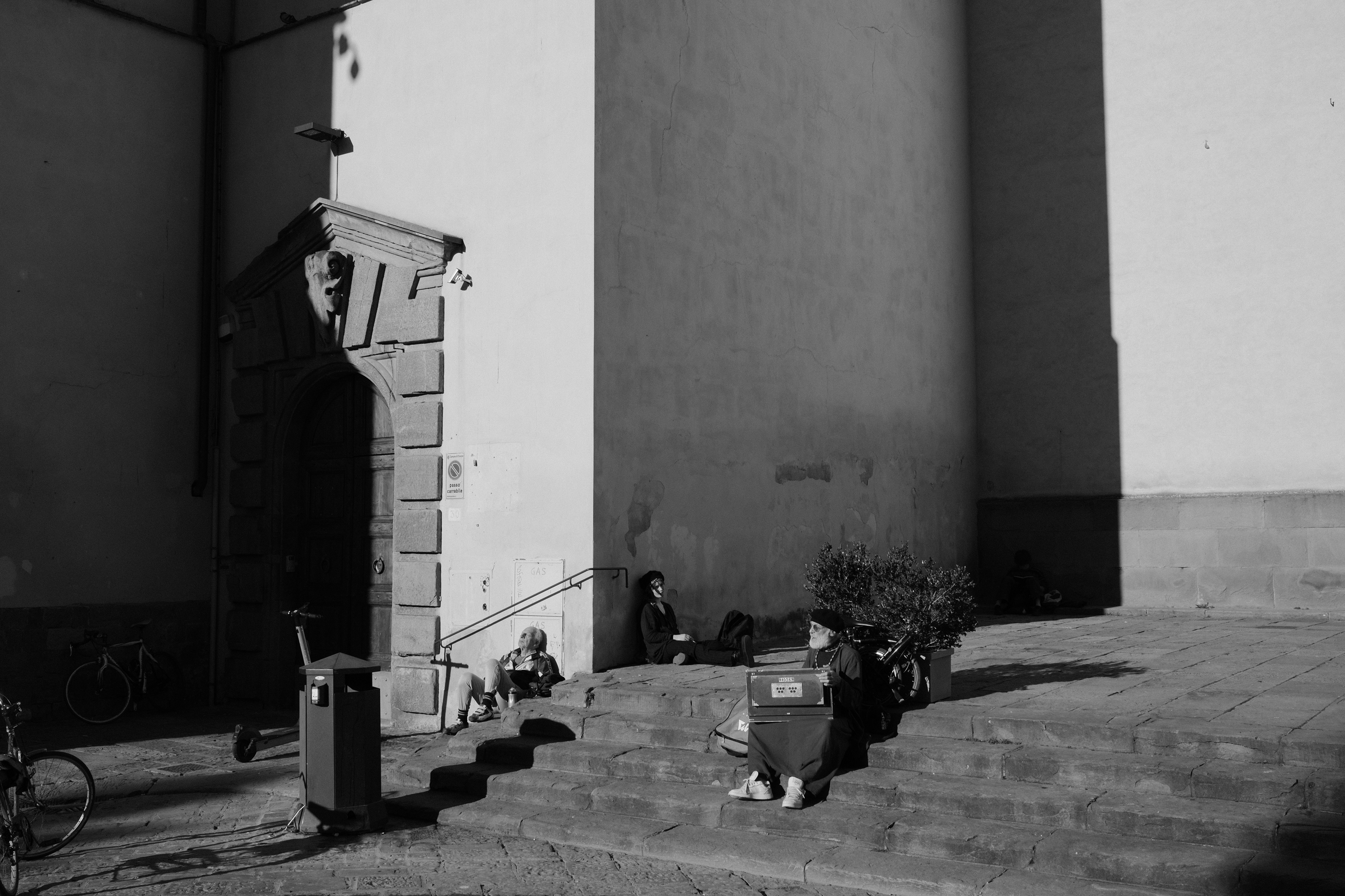People at Piazza Santo Spirito. Florence, Italy 2024.