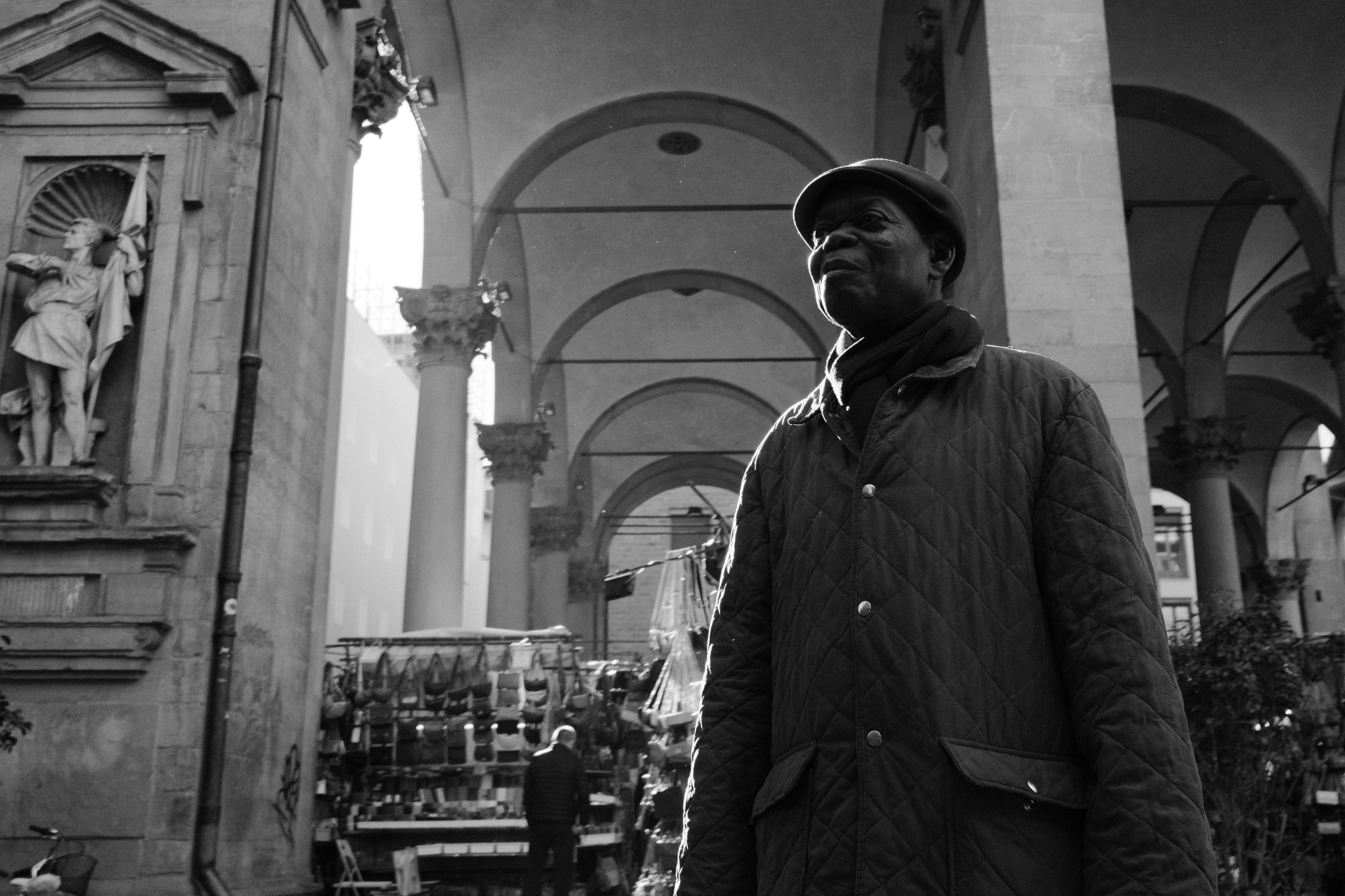 French man in front of Mercato del Porcellino. Florence, Italy 2024.